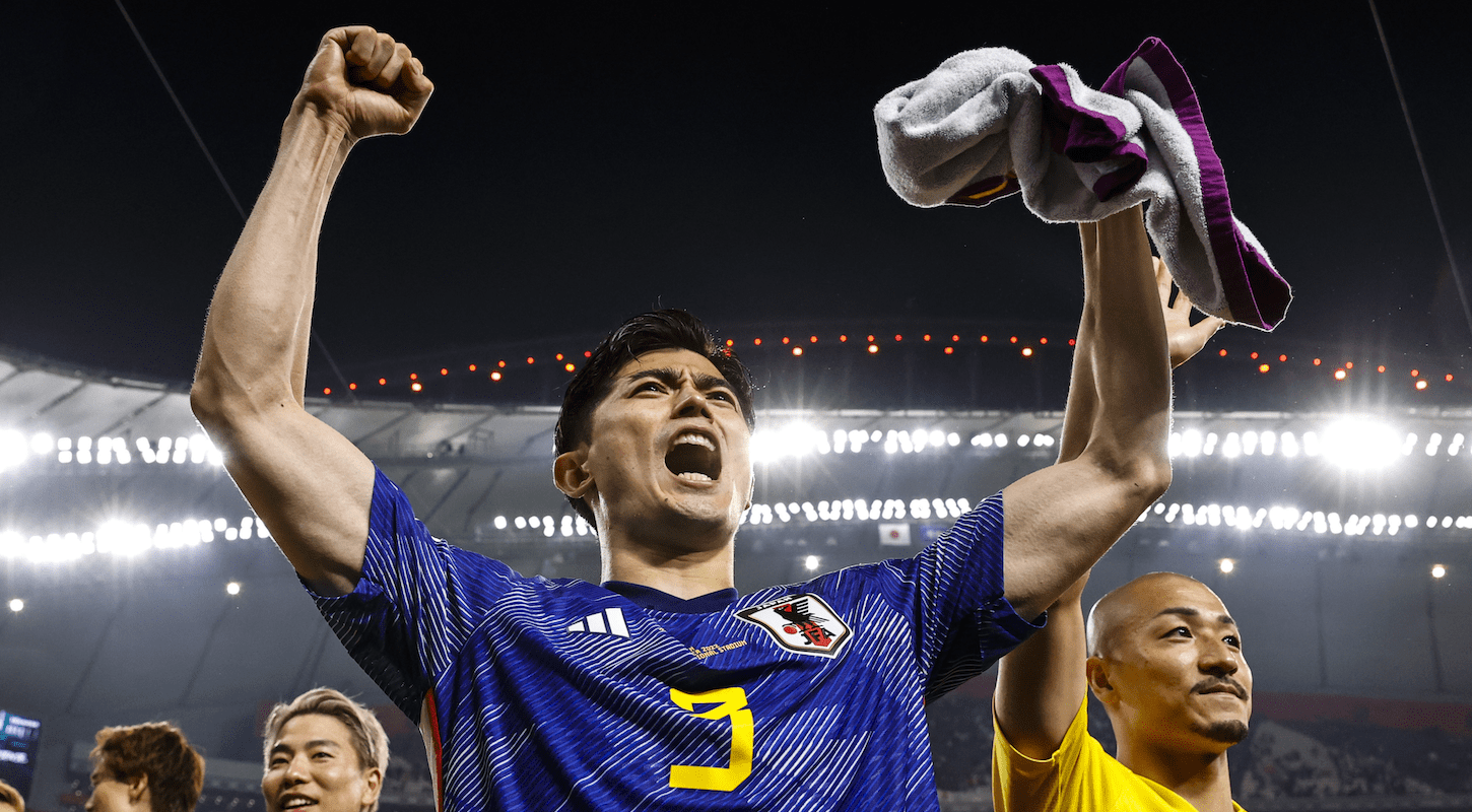 Japanese players celebrate their Group E win over Spain