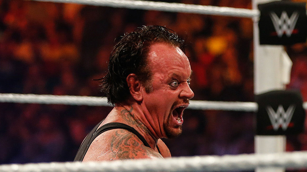 NEW YORK, NY - AUGUST 23: Brock Lesnar and The Undertaker battle it out at the WWE SummerSlam 2015 at Barclays Center of Brooklyn on August 23, 2015 in New York City. The photo has been cropped to make it a close-up of the Undertaker's funny face