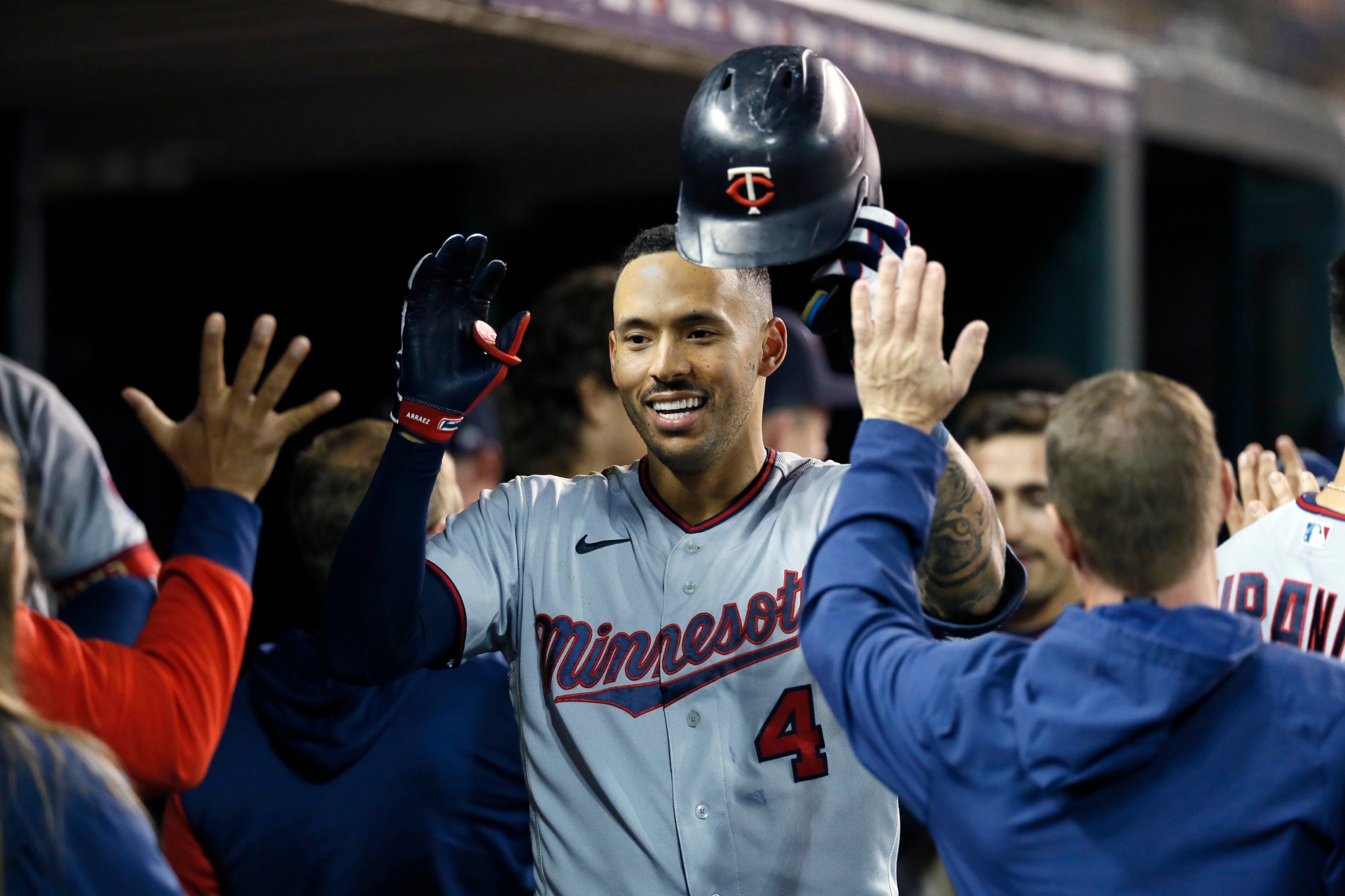 Carlos Correa congratulated by his former, and now future, Minnesota Twins teammates after a September 2022 home run.