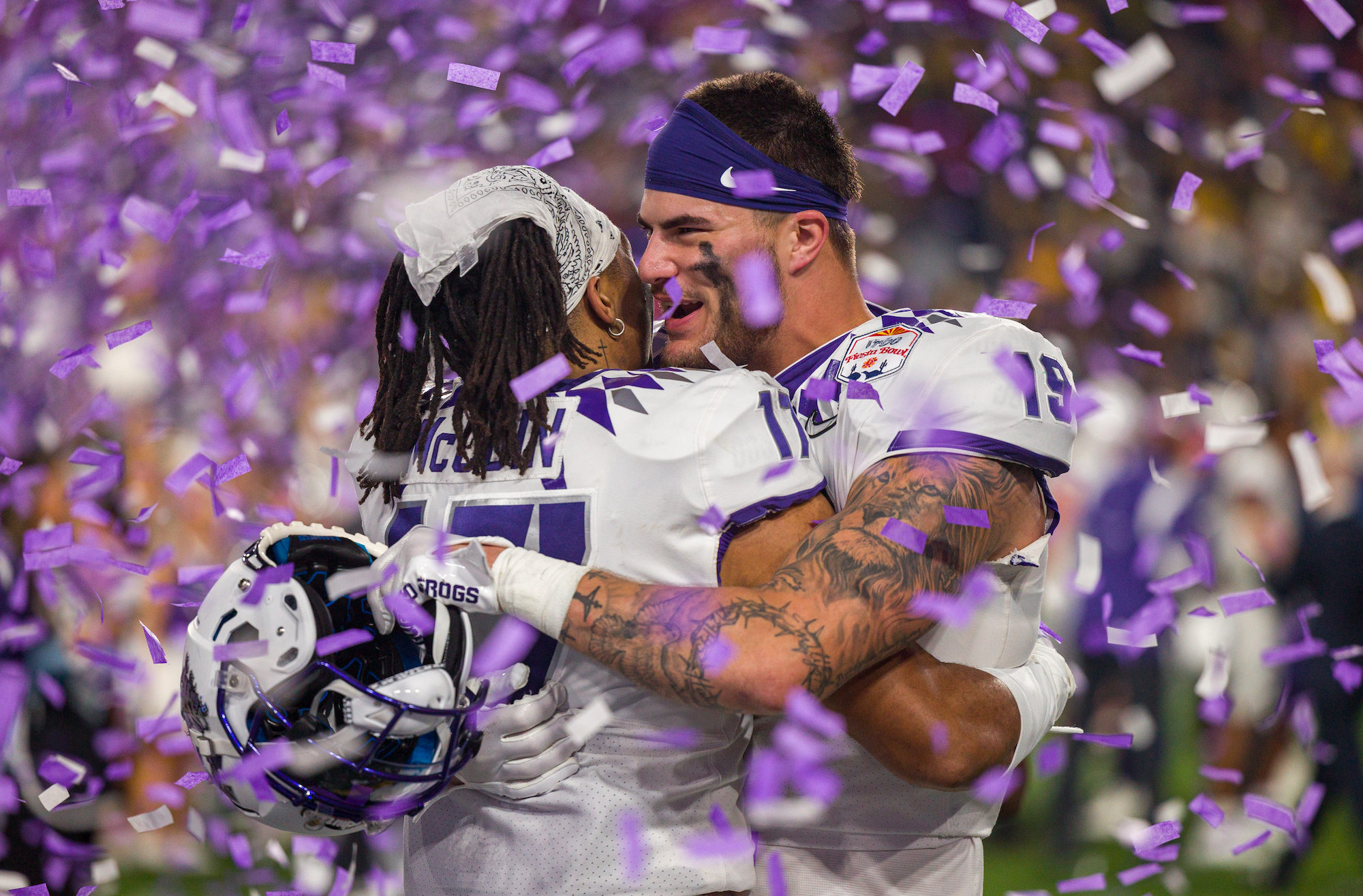 TCU Horned Frogs tight end Jared Wiley (19) hugs a teammate after the Vrbo Fiesta Bowl between the Michigan Wolverines and the TCU Horned Frogs on Saturday, December 31st, 2022 at State Farm Stadium in Glendale, AZ