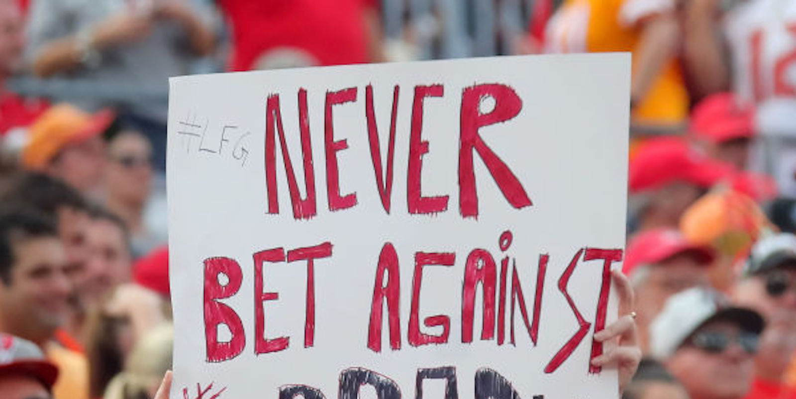 A Buccaneers fan holds a sign