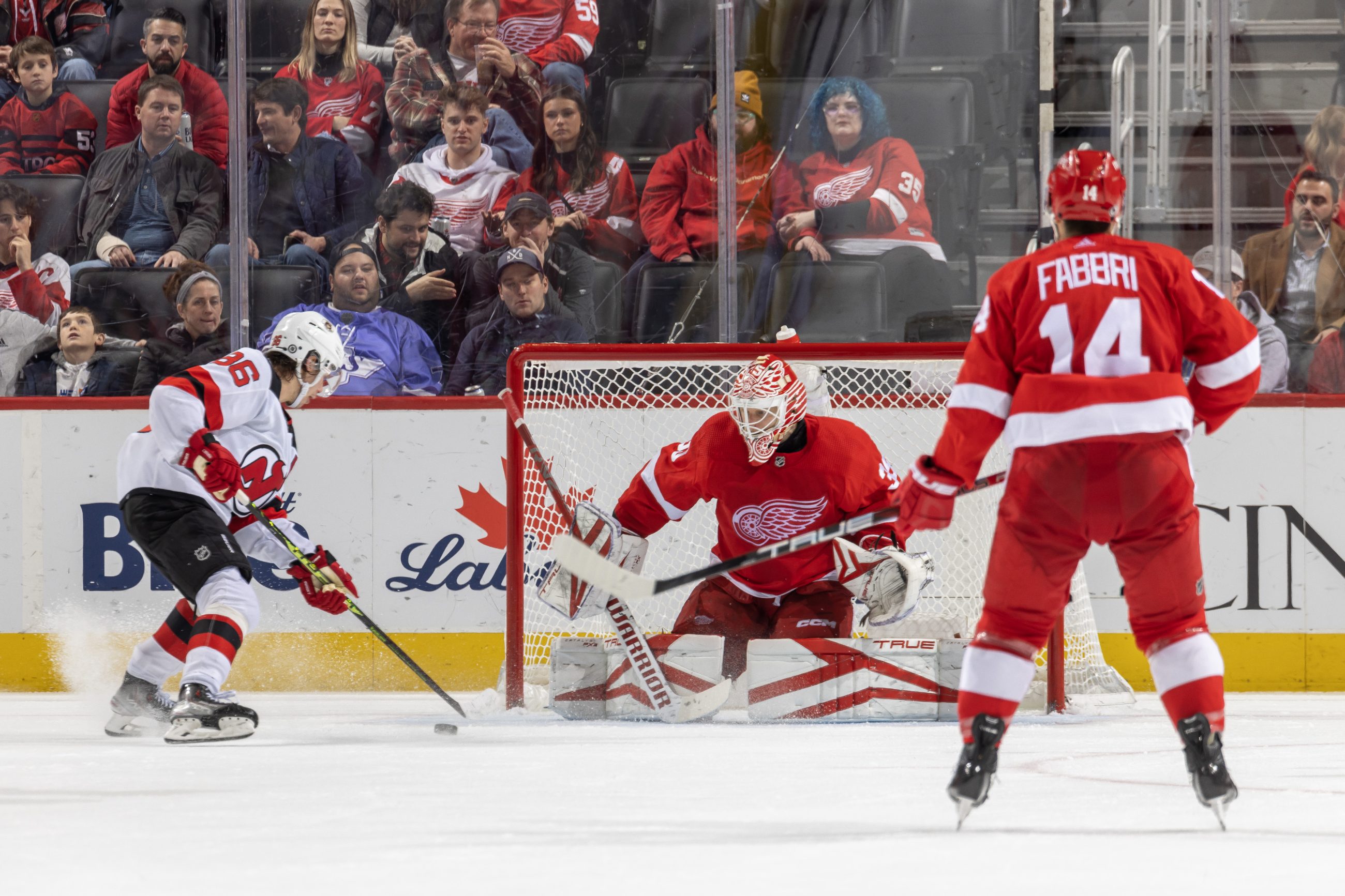 Jack Hughes stickhandles the puck before scoring