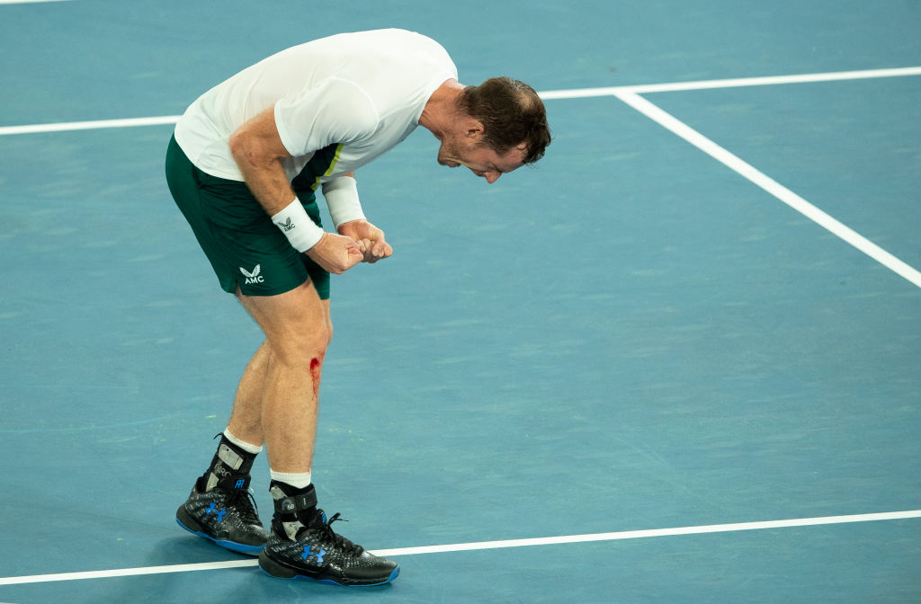 Andy Murray celebrates at the Australian Open with a bloody right knee