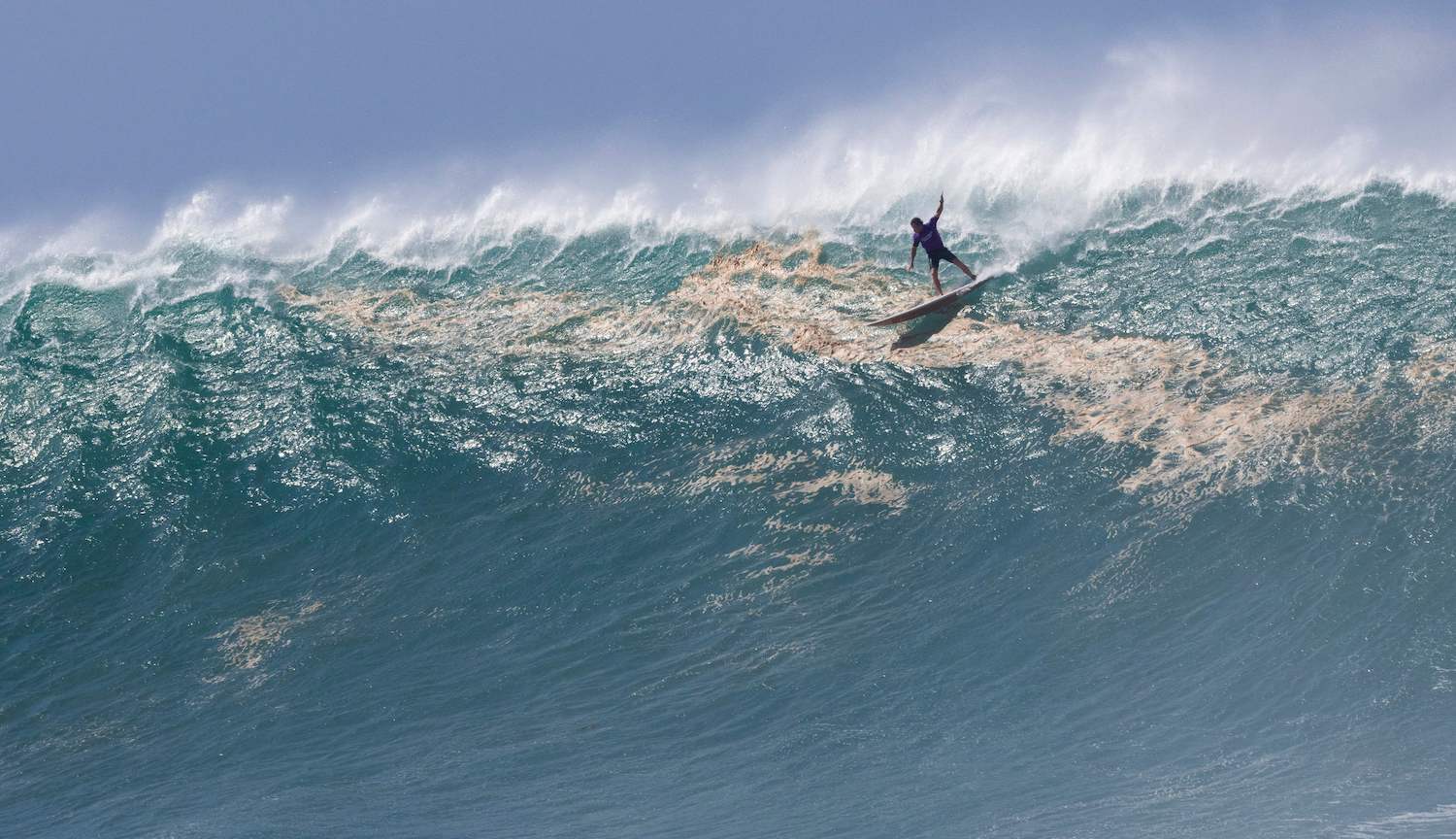 Hawaiian surfer Mark Healy rides a wave during The Eddie Aikau Big Wave Invitational surfing contest on January 22, 2023, at Waimea Bay on the North Shore of Oahu in Hawaii. - RESTRICTED TO EDITORIAL USE (Photo by Brian Bielmann / AFP) / RESTRICTED TO EDITORIAL USE (Photo by BRIAN BIELMANN/AFP via Getty Images)