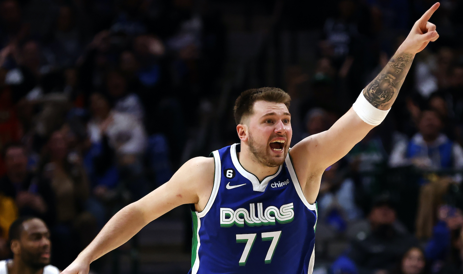 DALLAS, TX - JANUARY 30: Luka Doncic #77 of the Dallas Mavericks reacts after scoring a basket against the Detroit Pistons in the second half at American Airlines Center on January 30, 2023 in Dallas, Texas. The Mavericks won 111-105. NOTE TO USER: User expressly acknowledges and agrees that, by downloading and or using this photograph, User is consenting to the terms and conditions of the Getty Images License Agreement. (Photo by Ron Jenkins/Getty Images)