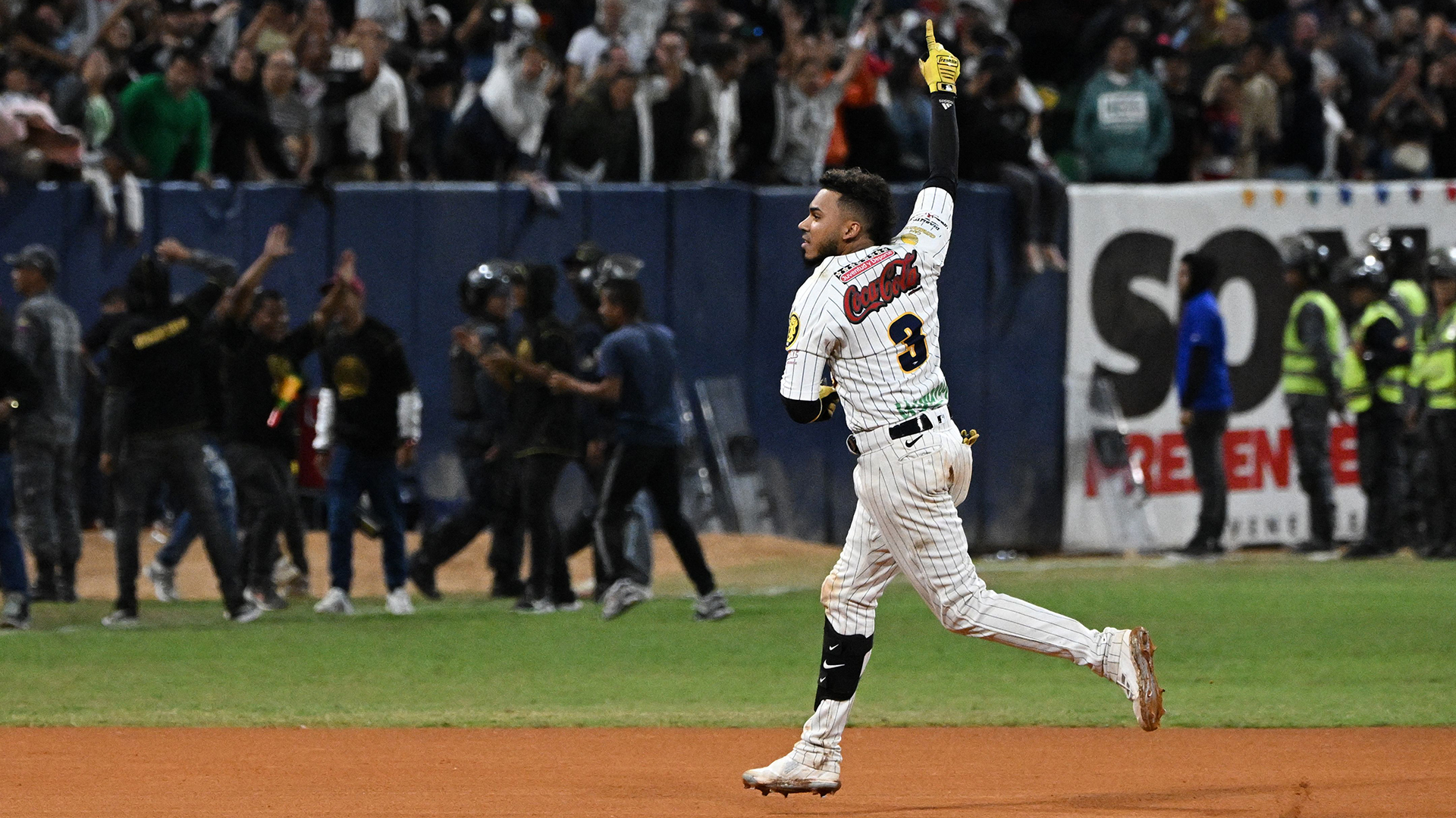 Harold Castro of Leones del Caracas reacts after hitting a home run against Tiburones de la Guaira during the Game Six of the Venezuelan Baseball League Championship Series at the Universitario stadium in Caracas, on January 30, 2023.
