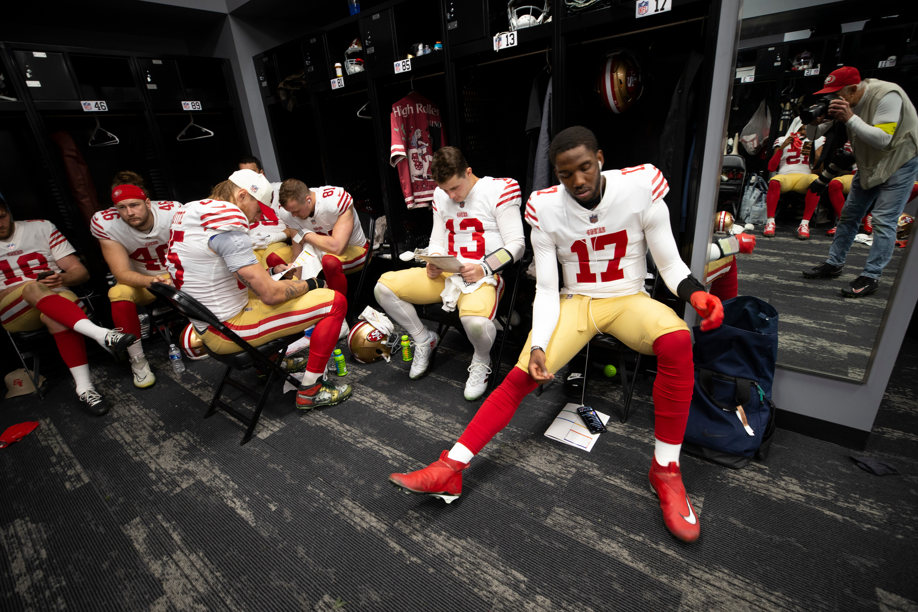 LAS VEGAS, NV - JANUARY 1: George Kittle #85, Brock Purdy #13 and Josh Johnson #17 of the San Francisco 49ers in the locker room before the game against the Las Vegas Raiders at Allegiant Stadium on January 1, 2023 in Las Vegas, Nevada. The 49ers defeated the Raiders 37-34. (Photo by Michael Zagaris/San Francisco 49ers/Getty Images) *** Local Caption *** George Kittle;Brock Purdy;Josh Johnson