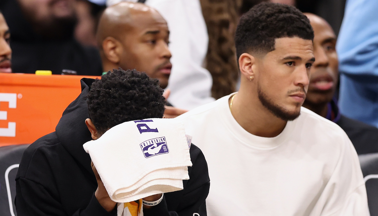 PHOENIX, ARIZONA - JANUARY 06: Cameron Payne #15 and Devin Booker #1 of the Phoenix Suns react on the bench during the final moments of the NBA game against the Miami Heat at Footprint Center on January 06, 2023 in Phoenix, Arizona. The Heat defeated the Suns 104-96. NOTE TO USER: User expressly acknowledges and agrees that, by downloading and or using this photograph, User is consenting to the terms and conditions of the Getty Images License Agreement. (Photo by Christian Petersen/Getty Images)