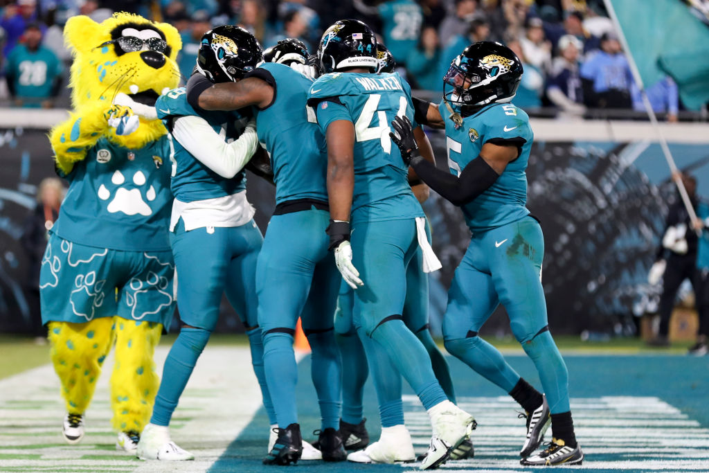 The Jaguars celebrate after a fumble returned for a touchdown