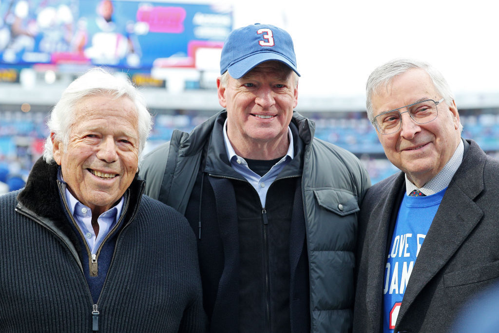 Goodell, wearing a Damar Hamlin No. 3 hat, poses with Patriots owner Robert Kraft and Buffalo Bills owner Terry Pegula prior to a game between the New England Patriots and the Buffalo Bills at Highmark Stadium on January 08, 2023 in Orchard Park, New York.