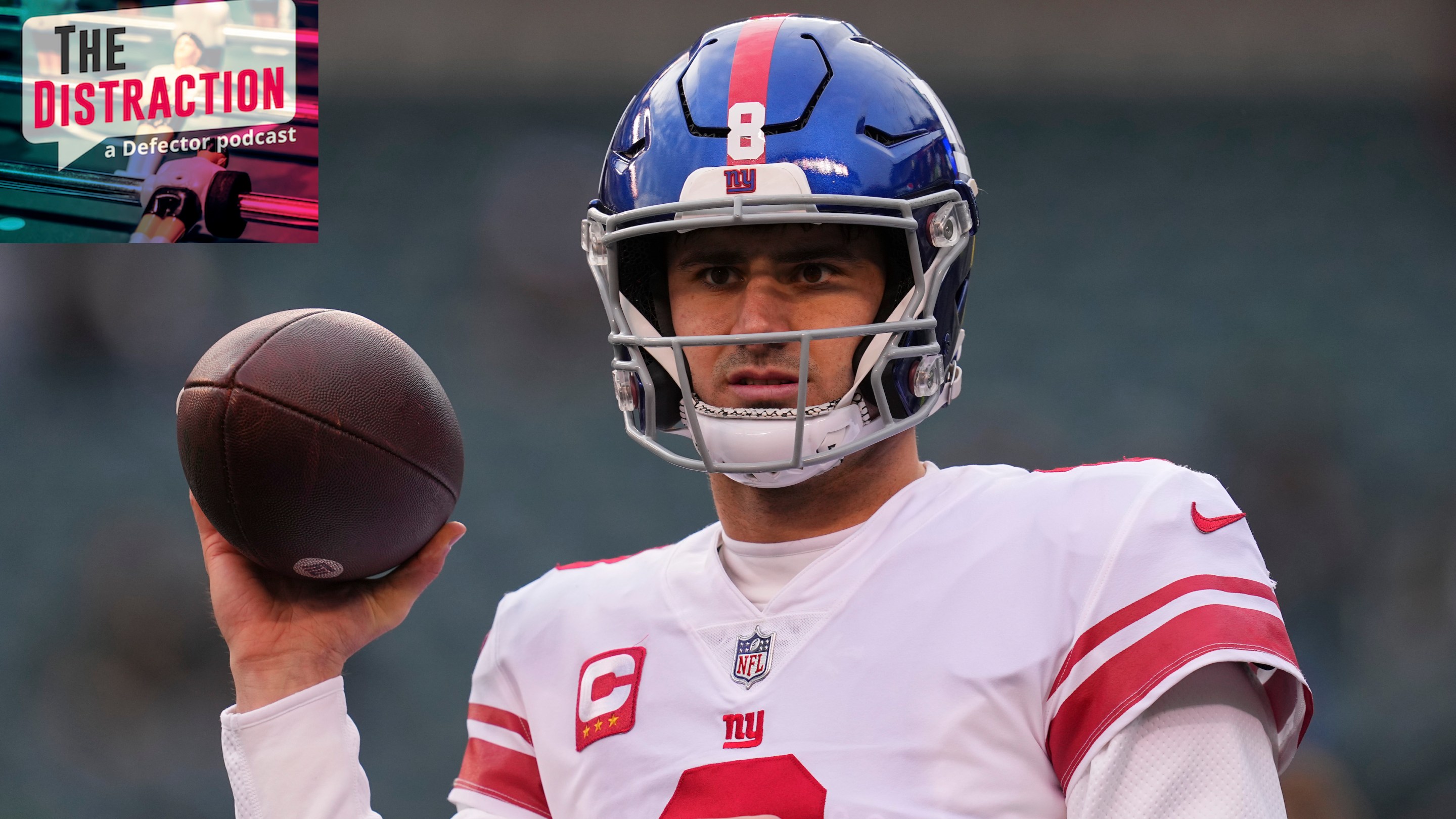 Daniel Jones looking confused and holding a football in a silly way before the Giants' Week 18 game against the Eagles.