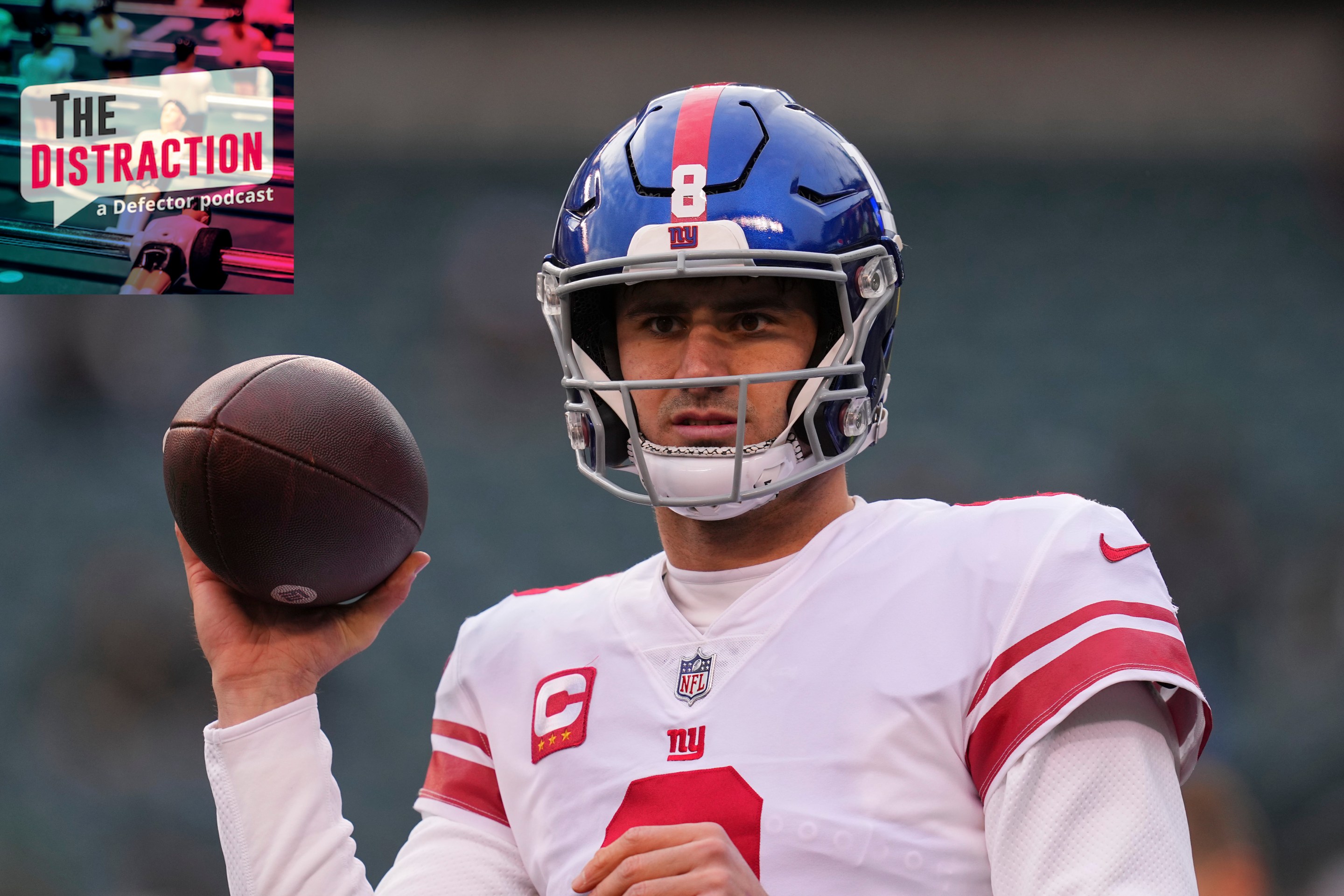 Daniel Jones looking confused and holding a football in a silly way before the Giants' Week 18 game against the Eagles.