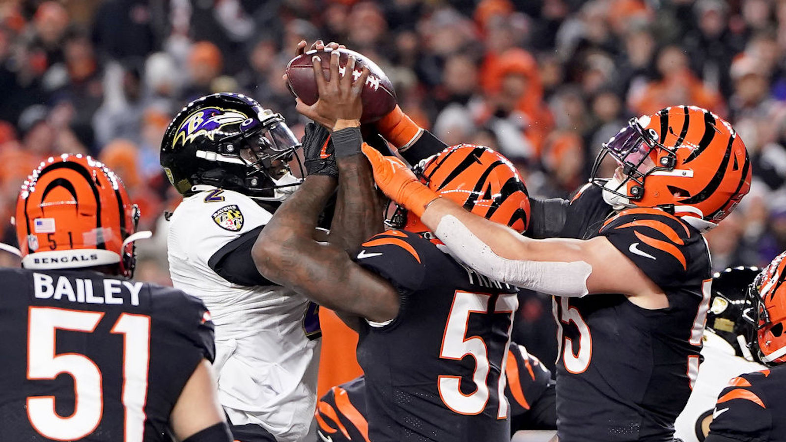 Tyler Huntley attempts a quarterback sneak.