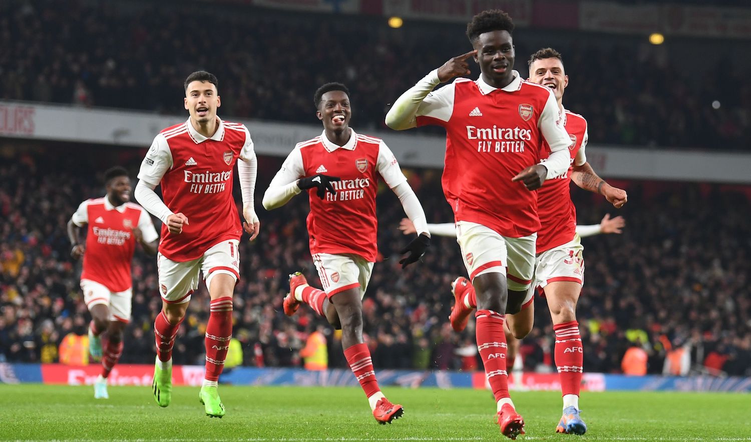 LONDON, ENGLAND - JANUARY 22: Bukayo Saka celebrates scoring the 2nd Arsenal goal during the Premier League match between Arsenal FC and Manchester United at Emirates Stadium on January 22, 2023 in London, England. (Photo by Stuart MacFarlane/Arsenal FC via Getty Images)