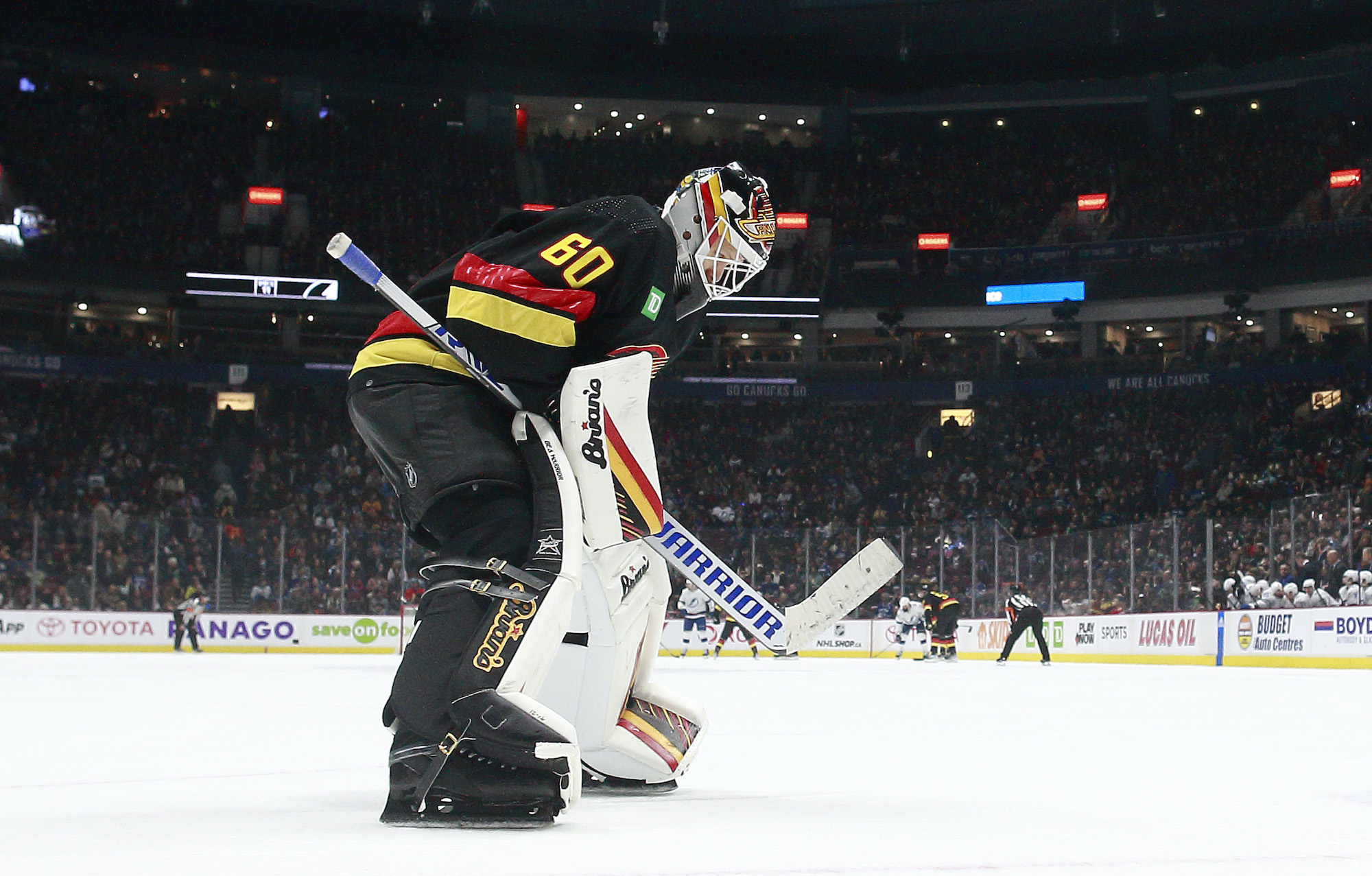 Collin Delia #60 of the Vancouver Canucks skates up ice during their NHL game against the Tampa Bay Lightning at Rogers Arena January 18, 2023 in Vancouver.