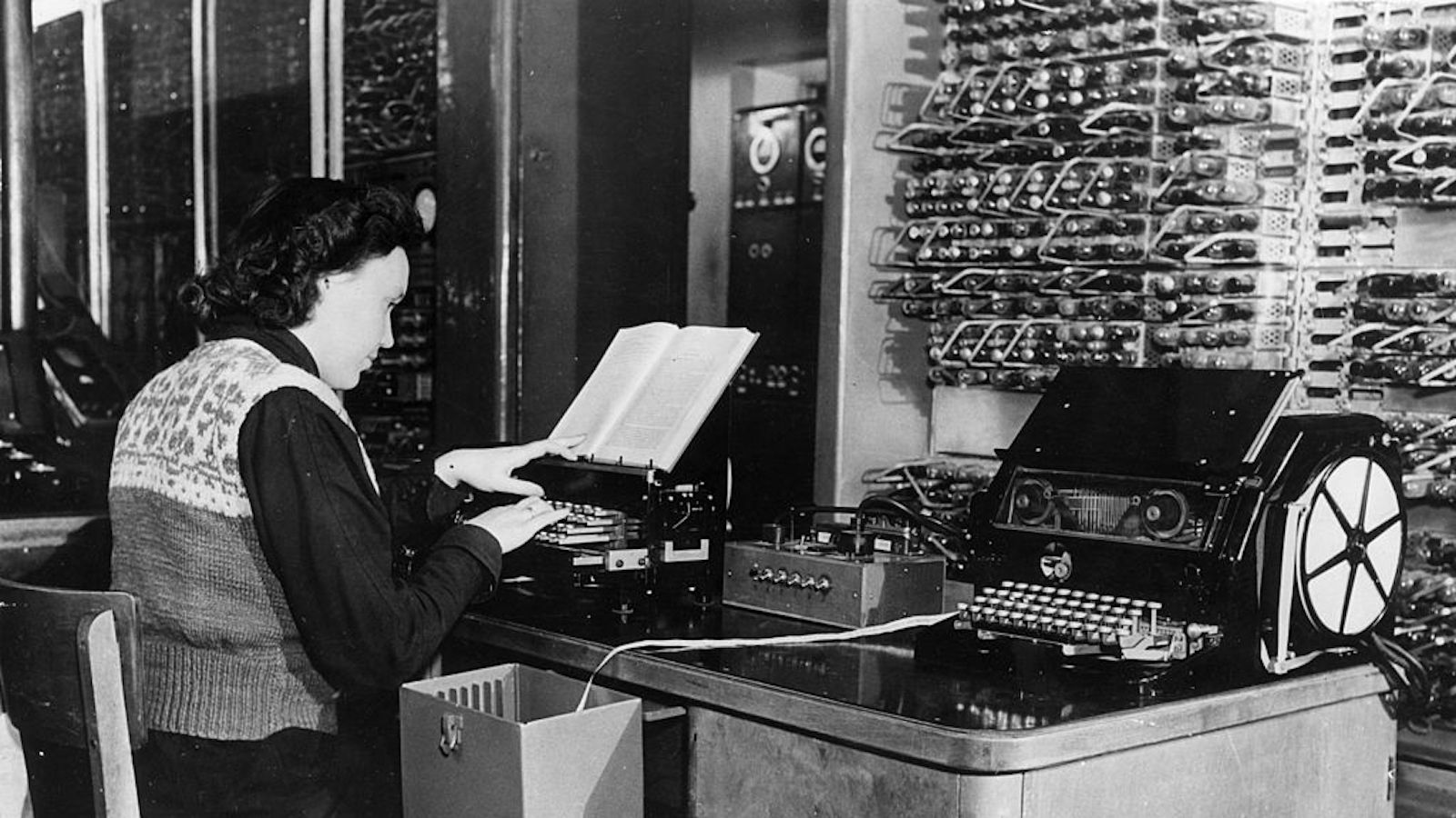 Woman typing at an old computer