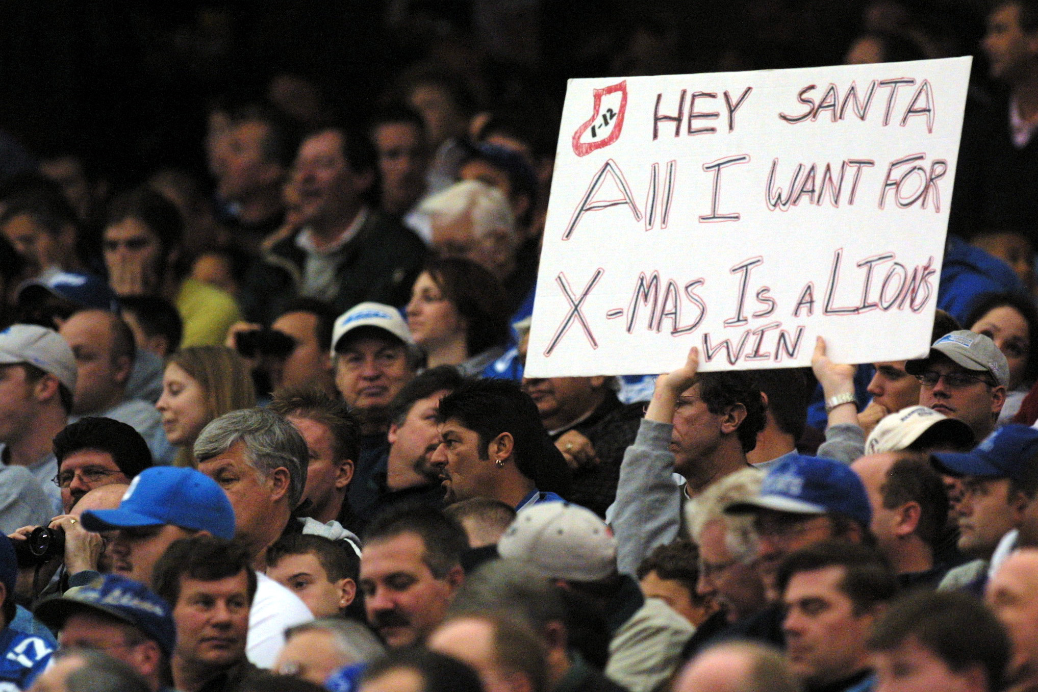 Lions fan's sign asking Santa for a win