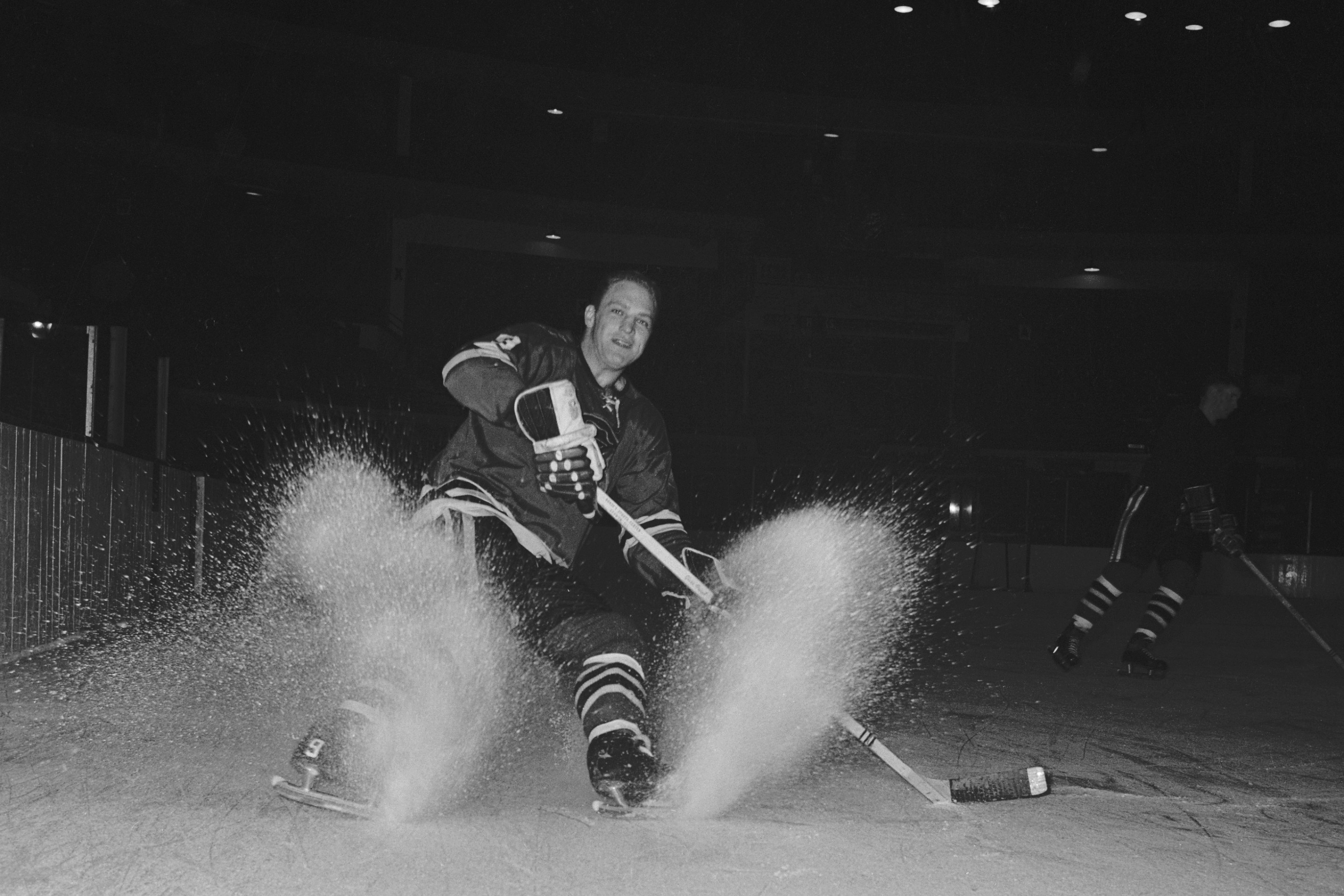 (Original Caption) Chicago Black Hawk Bobby Hull skids to a stop on the ice.