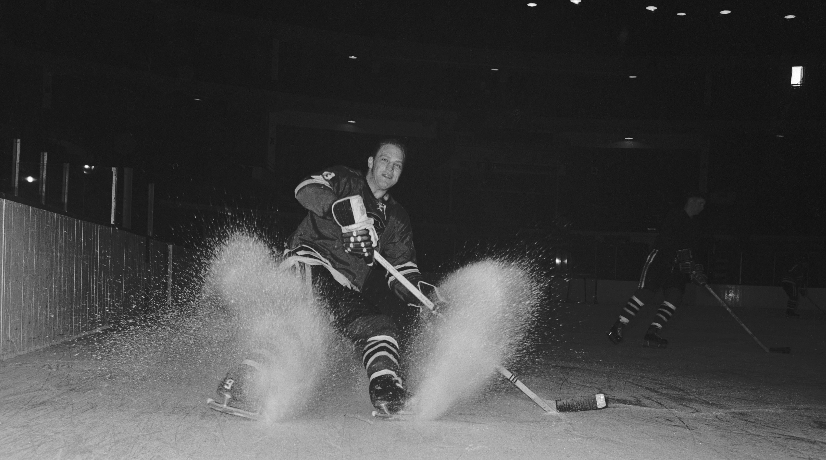 (Original Caption) Chicago Black Hawk Bobby Hull skids to a stop on the ice.