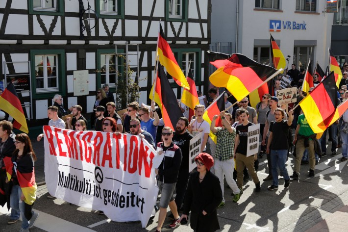 KANDEL, RHINELAND-PALATINATE, GERMANY - 2018/04/07: The protesters march with flags and banners through Kandel. Around 500 people from right-wing organisations protested in the city of Kandel in Palatinate against refugees, foreigners and the German government. They called for more security of Germans and women from the alleged increased violence by refugees. The place of the protest was chosen because of the 2017 Kandel stabbing attack, in which a 15 year old girl was killed by an asylum seeker. (Photo by Michael Debets/Pacific Press/LightRocket via Getty Images)