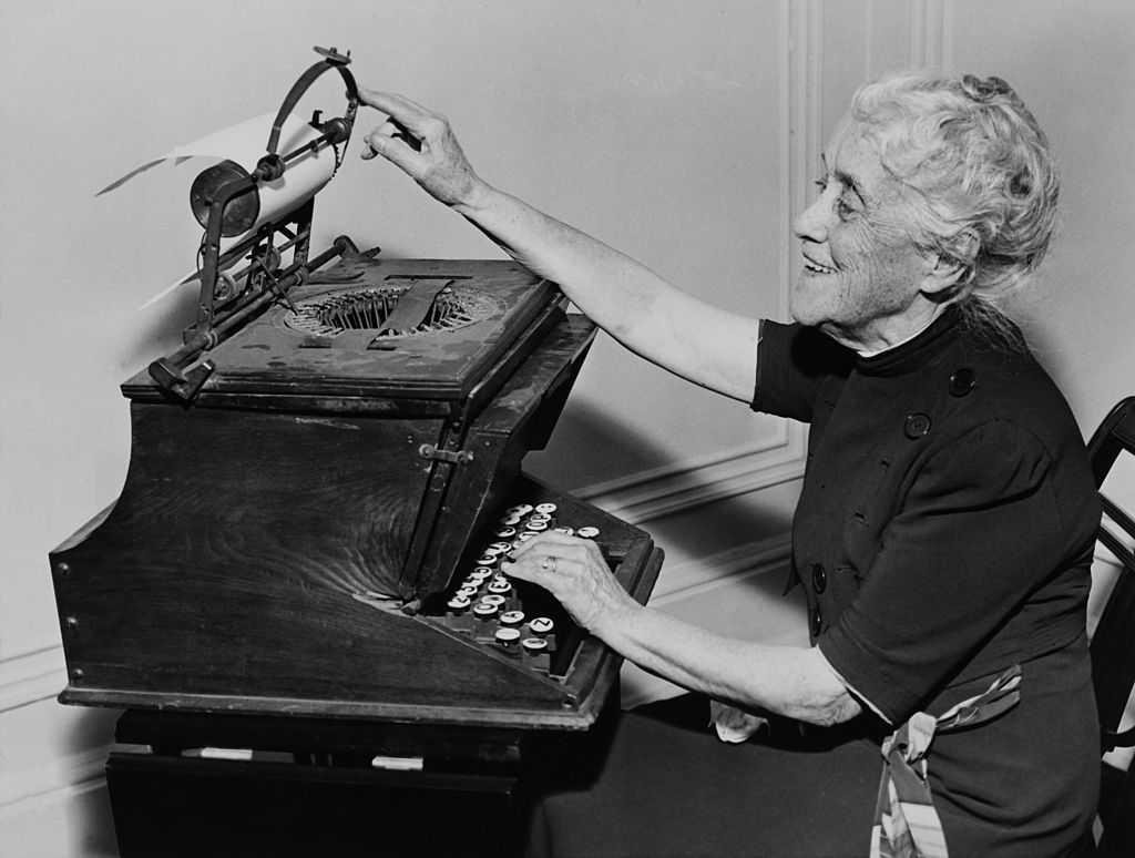 A woman using a typewriter