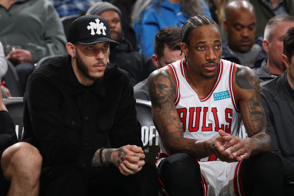 Lonzo Ball sits on the bench at the Bulls game
