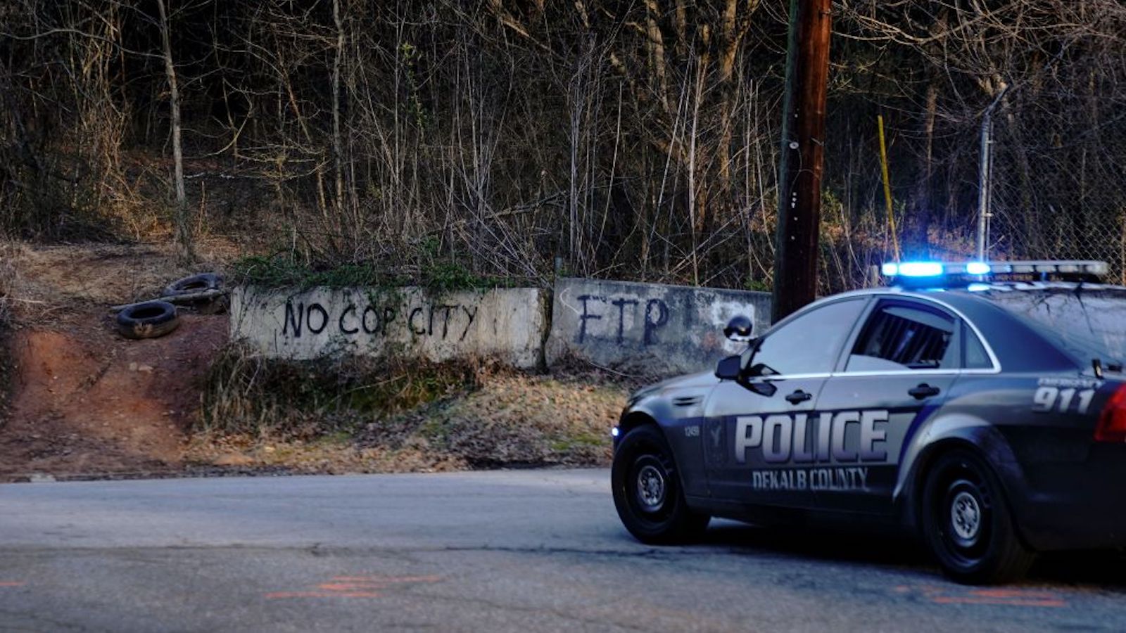 A police car near the site of Atlanta's proposed Cop City