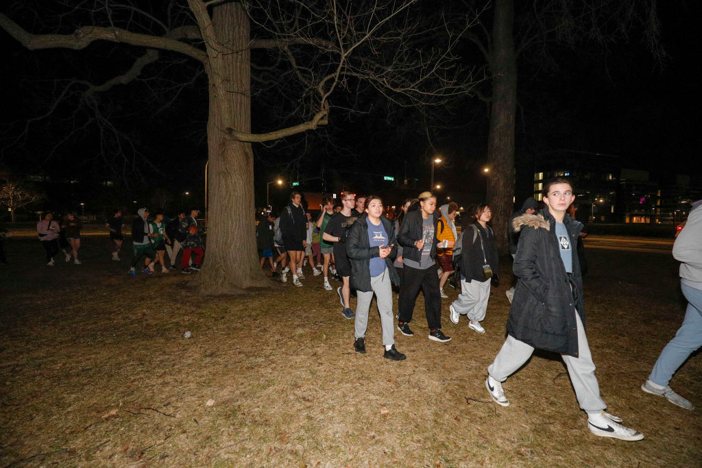 Michigan State University students evacuate to a safe area
