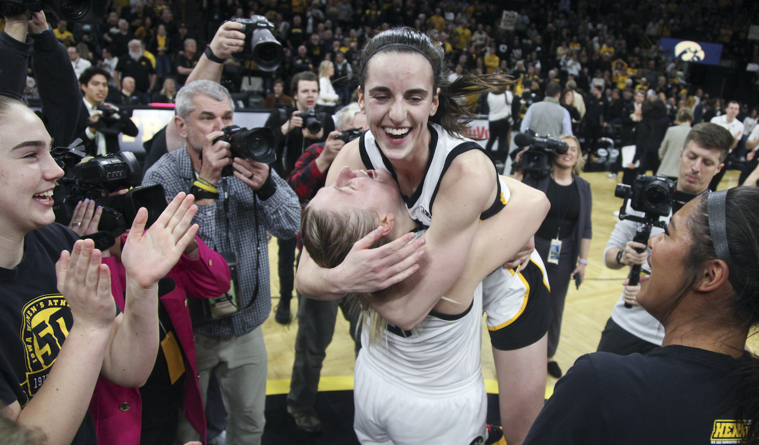 IOWA CITY, IOWA- FEBRUARY 26: Guard Caitlin Clark #22 of the Iowa Hawkeyes celebrates with forward Monika Czinano #25 after their match-up against the Indiana Hoosiers at Carver-Hawkeye Arena, on February 26, 2023 in Iowa City, Iowa. (Photo by Matthew Holst/Getty Images) *** Local Caption *** Caitlin Clark;Monika Czinano