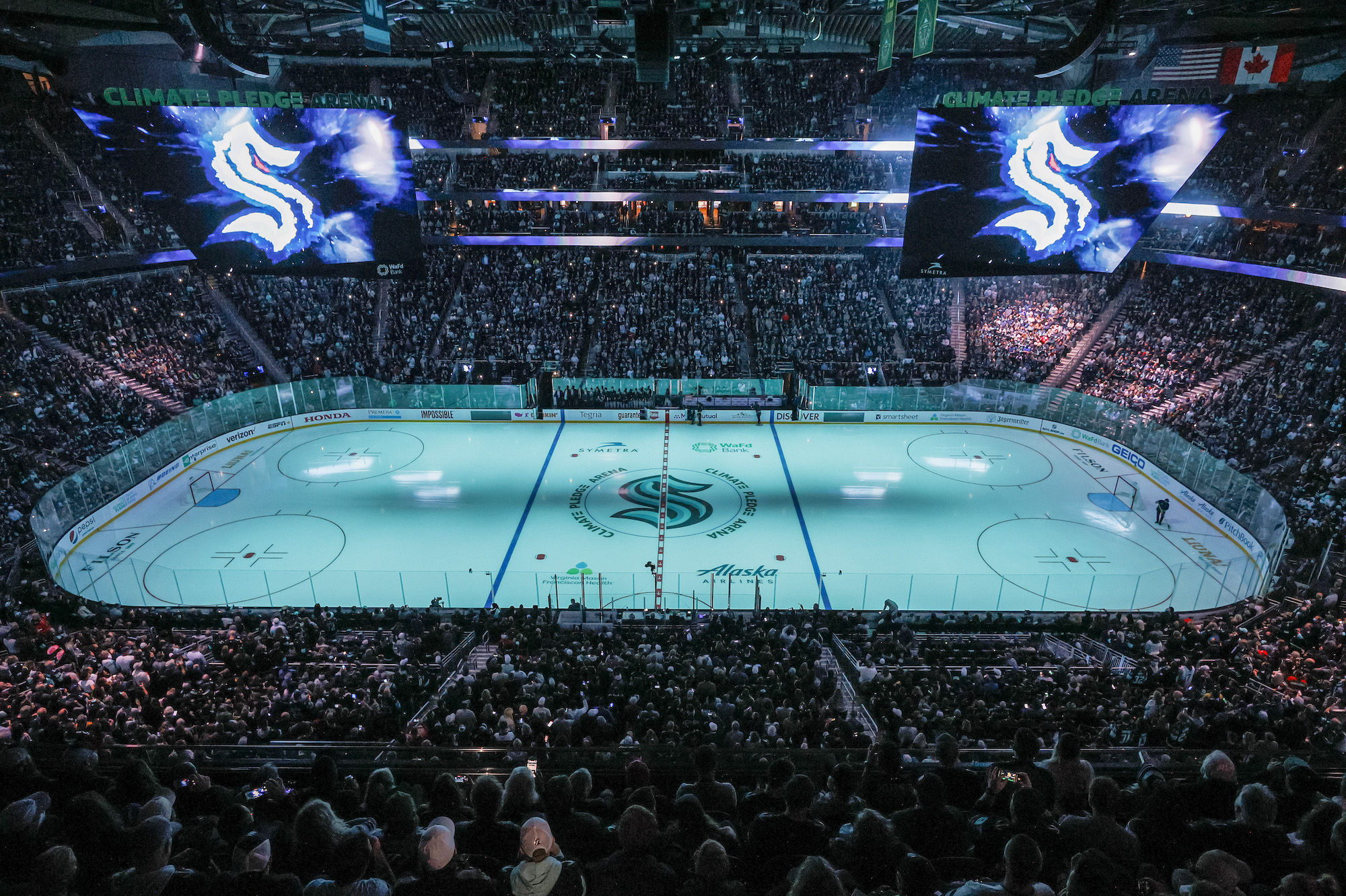 SEATTLE, WASHINGTON - OCTOBER 23: A general view of Climate Pledge Arena with the center ice logo prior to the Kraken's inaugural home opening game between the Seattle Kraken and the Vancouver Canucks on October 23, 2021 in Seattle, Washington. (Photo by Steph Chambers/Getty Images)