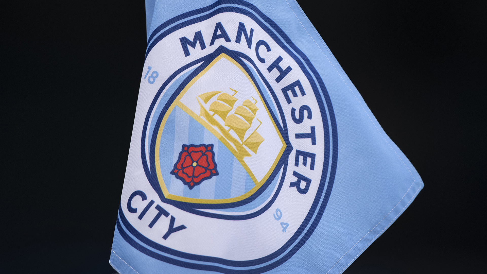 The official Manchester City club badge on a cornerflag ahead of the Premier League match between Manchester City and Everton FC at Etihad Stadium on December 31, 2022 in Manchester, United Kingdom.