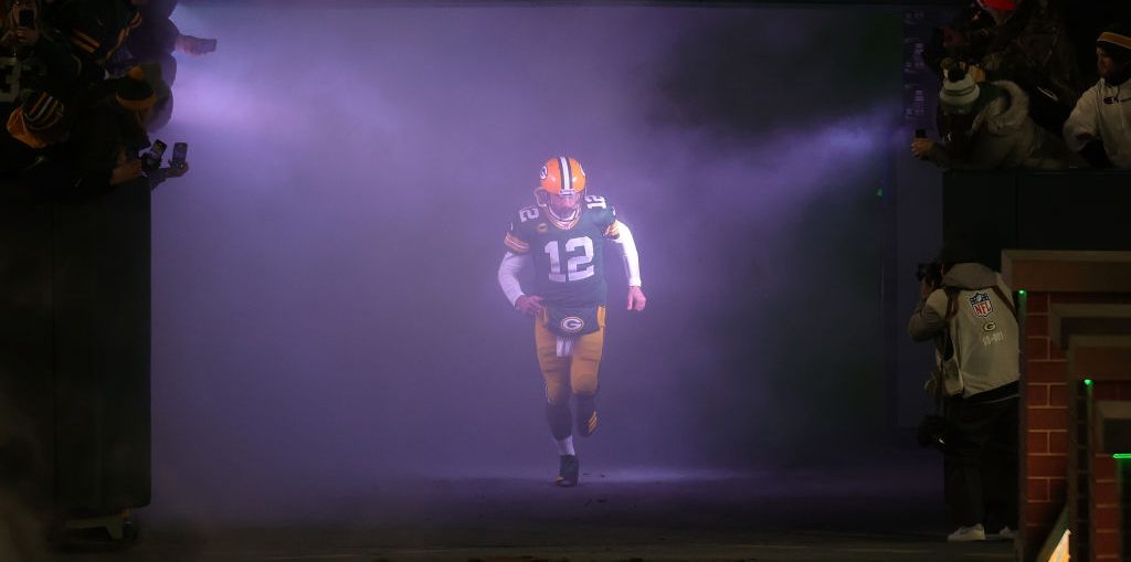 GREEN BAY, WISCONSIN - JANUARY 08: Aaron Rodgers #12 of the Green Bay Packers takes the field for player introductions prior to a game against the Detroit Lions at Lambeau Field on January 08, 2023 in Green Bay, Wisconsin. The Lions defeated the Packers 20-16.