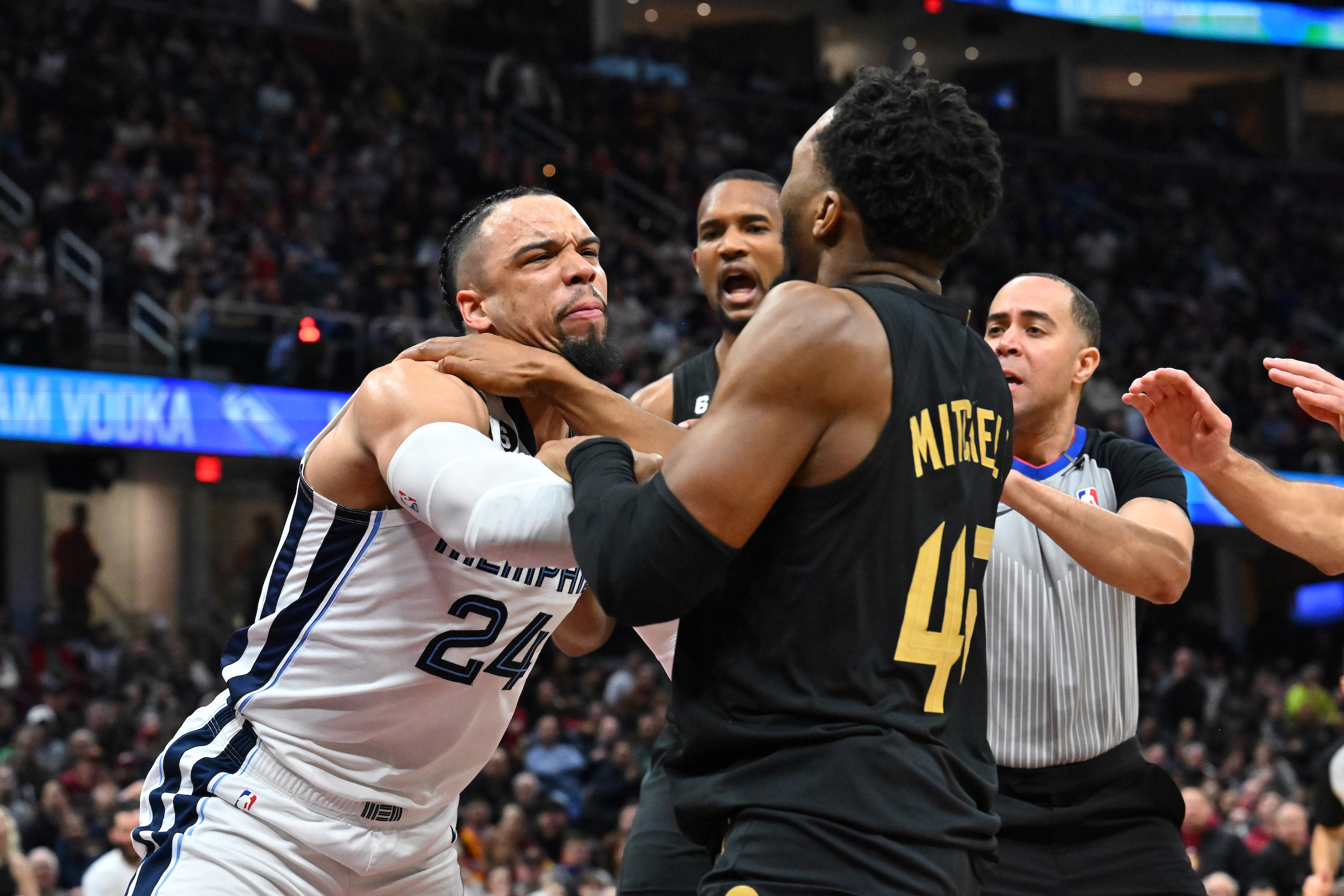 Dillon Brooks and Donovan Mitchell exchange shoves.