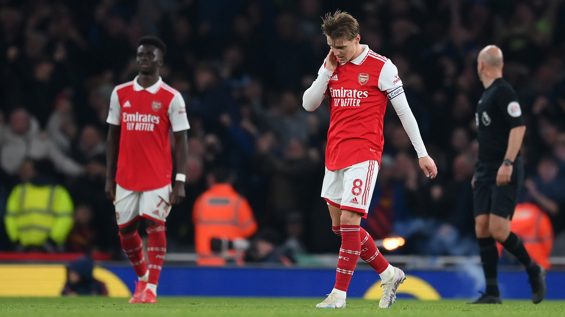Martin Odegaard of Arsenal looks dejected during the Premier League match between Arsenal FC and Manchester City at Emirates Stadium on February 15, 2023 in London, England.