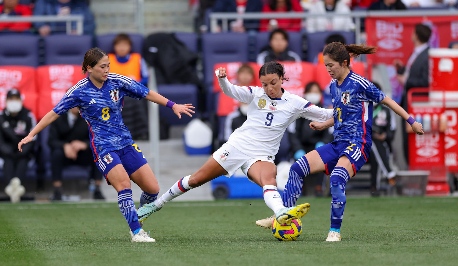 NASHVILLE, TN - FEBRUARY 19: Mallory Swanson #9 of the United States is marked by Fuka Nagano #8 and Risa Shimizu #2 of Japan during a game between Japan and USWNT at GEODIS Park on February 19, 2023 in Nashville, Tennessee. (Photo by John Dorton/ISI Photos/Getty Images)