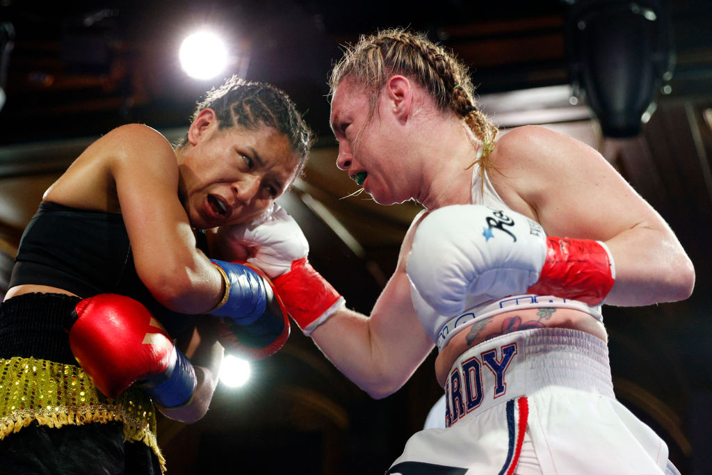 NEW YORK, NEW YORK - FEBRUARY 23: Taynna Cardoso of Brazil (black trunks) trades punches with Heather Hardy (white trunks) during their Super Featherweights bout at BoxingInsider Fight Night at Sony Hall on February 23, 2023 in New York City. Hardy won by majority decision.