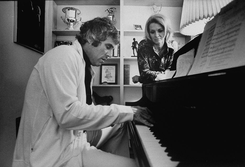 Burt Bacharach plays a piano