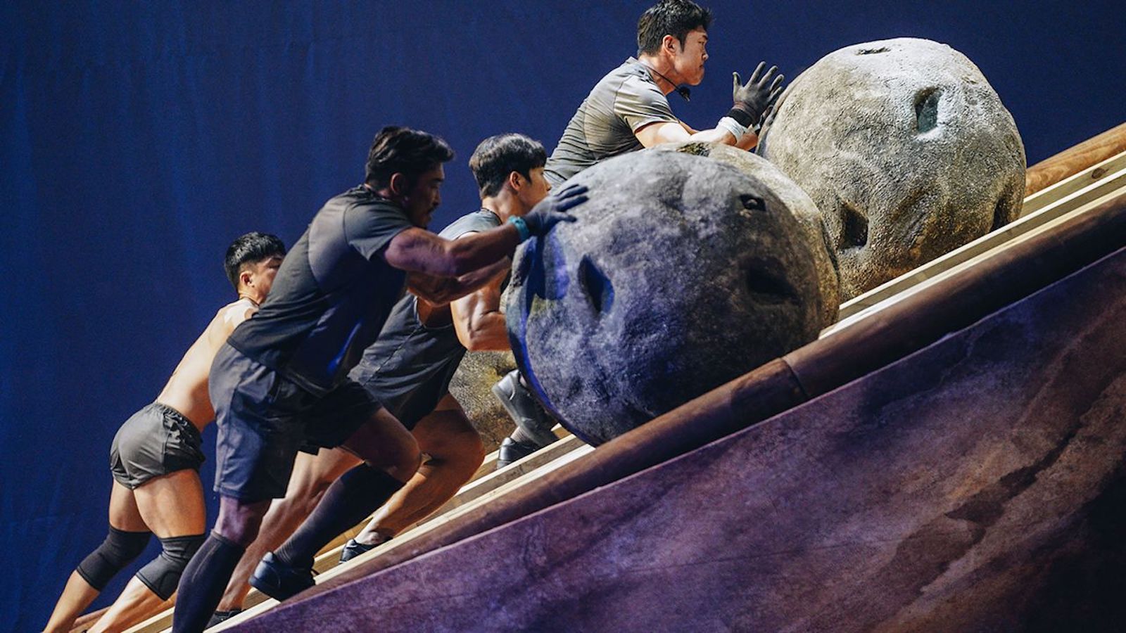 Contestants compete in Physical: 100