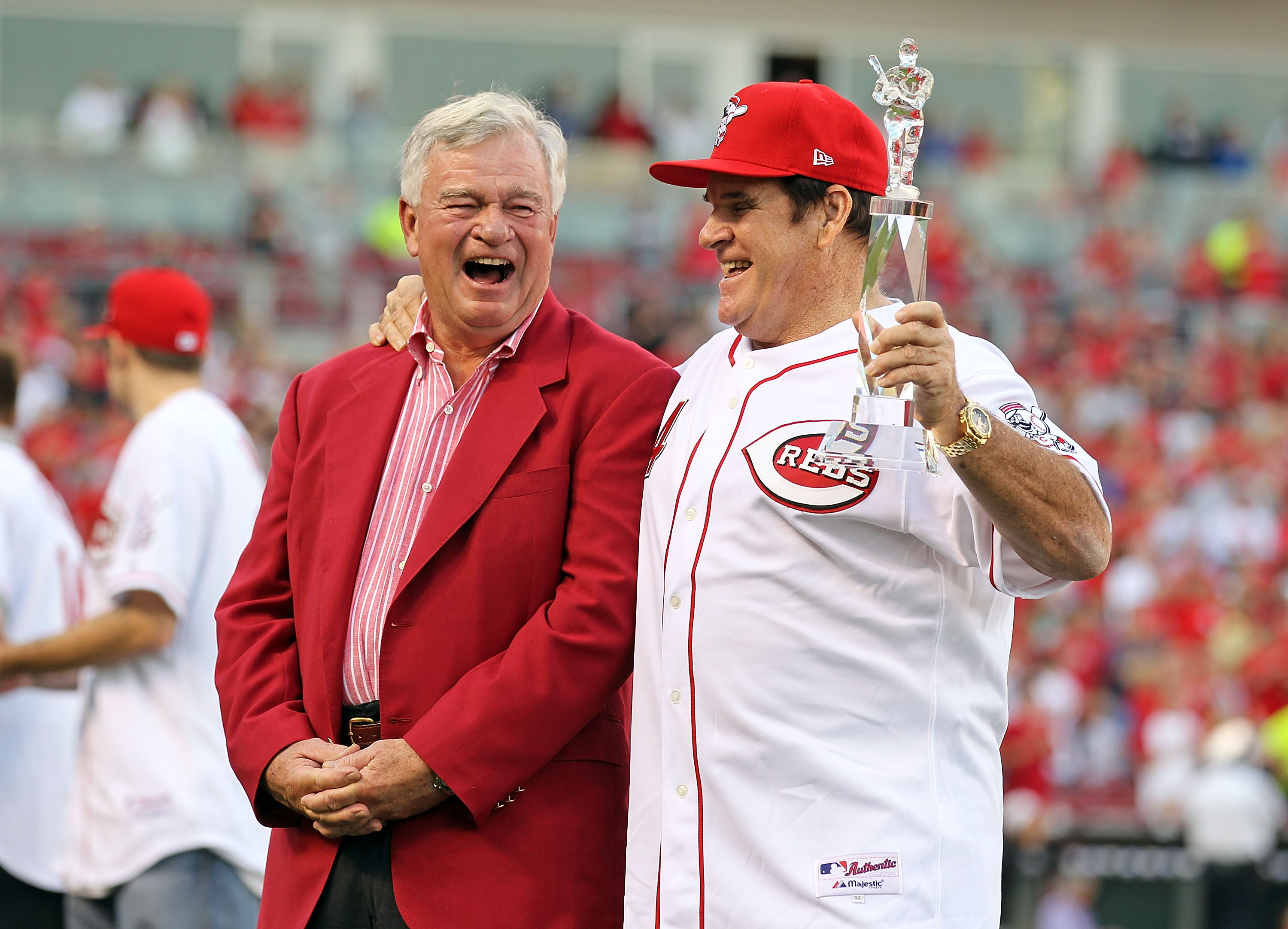 Cincinnati Reds CEO Bob Castellini and disgraced Reds legend Pete Rose yuk it up at an event honoring Rose's hit record, in 2010.