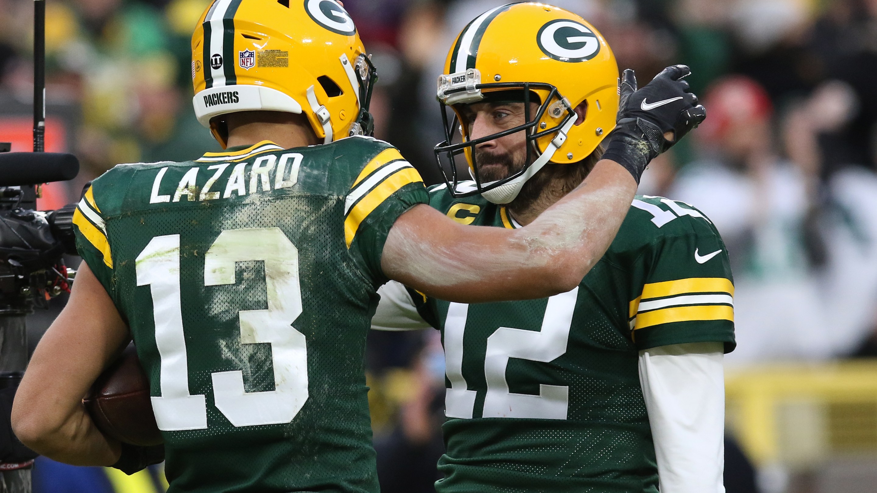 Aaron Rodgers is congratulated by Allen Lazard during a Packers game on Christmas Day in 2021.