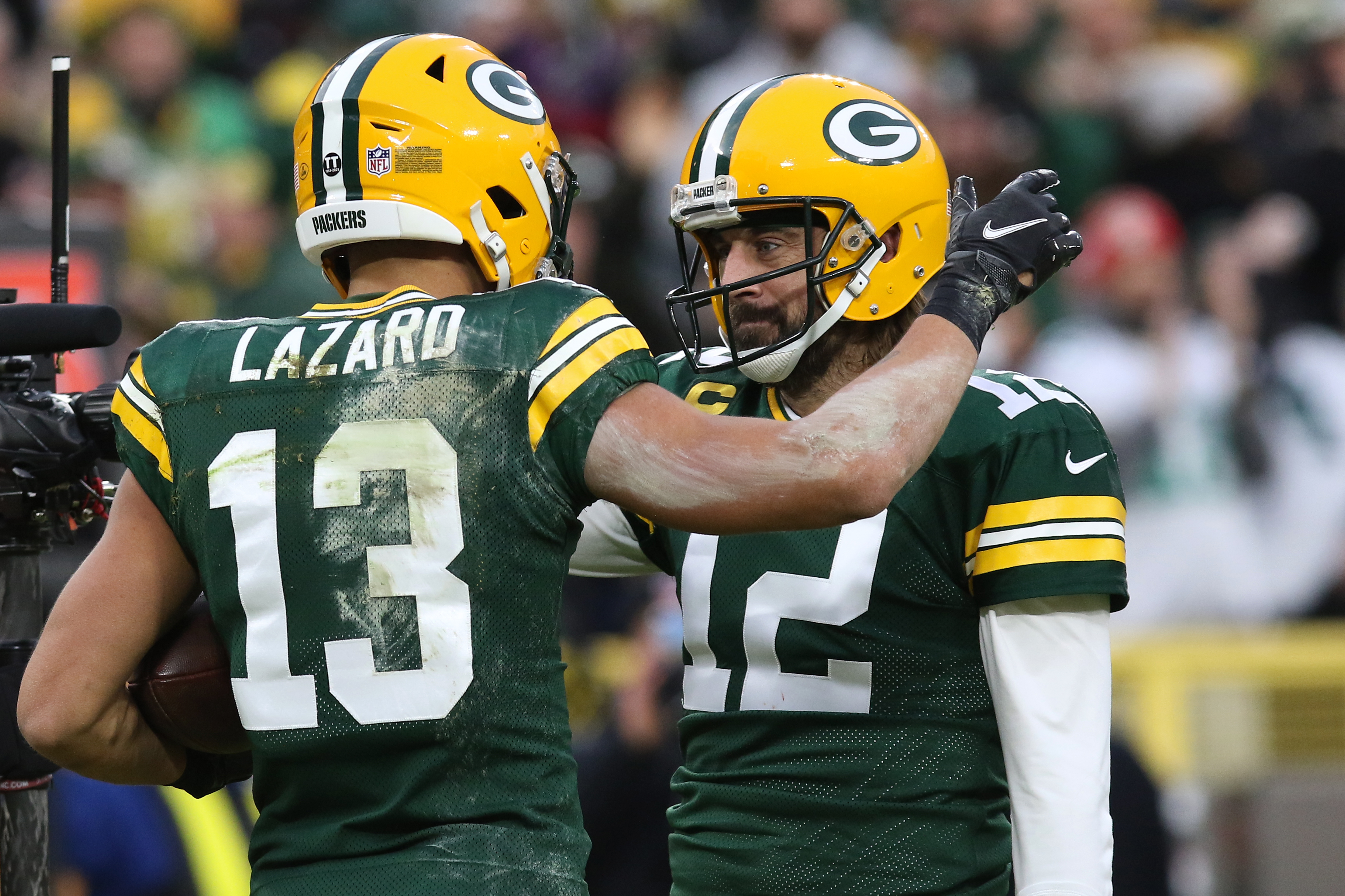 Aaron Rodgers is congratulated by Allen Lazard during a Packers game on Christmas Day in 2021.