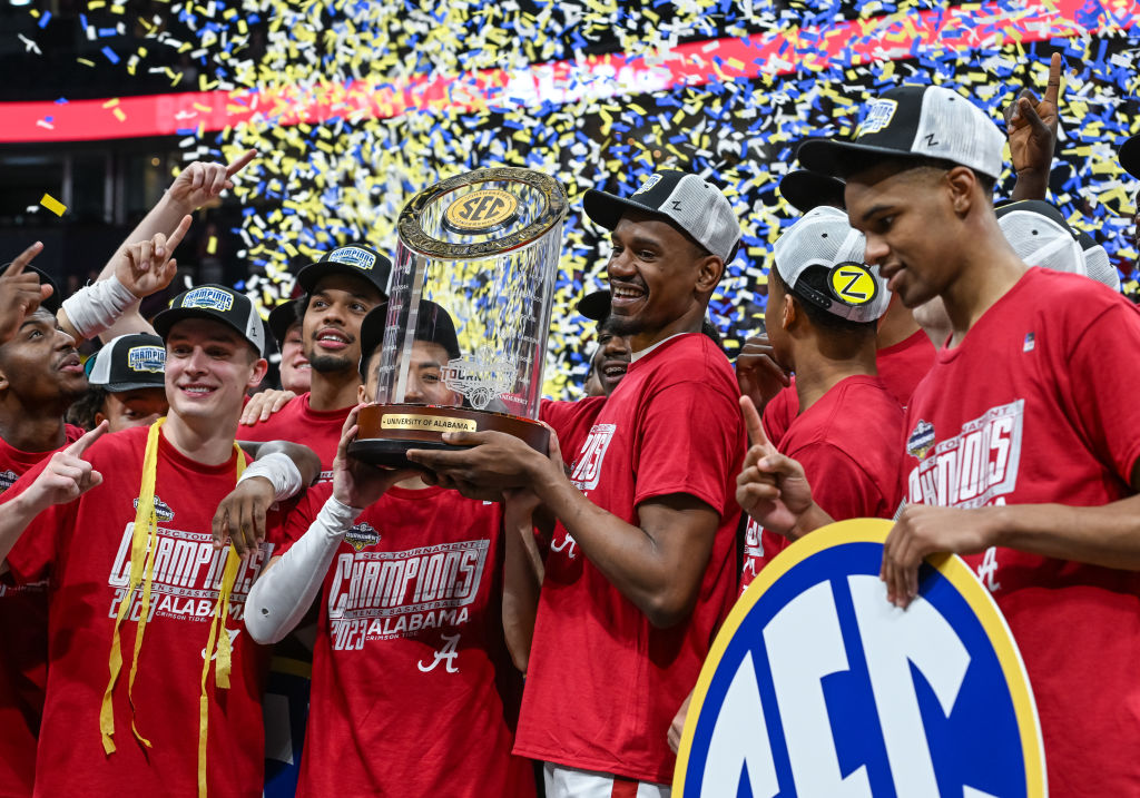Alabama Crimson Tide players celebrate winning the SEC Mens Basketball Tournament championship game between the Alabama Crimson Tide and the Texas A&amp;M Aggies on March 12, 2023 at Bridgestone Arena in Nashville, TN. (Photo by Bryan Lynn/Icon Sportswire via Getty Images)
