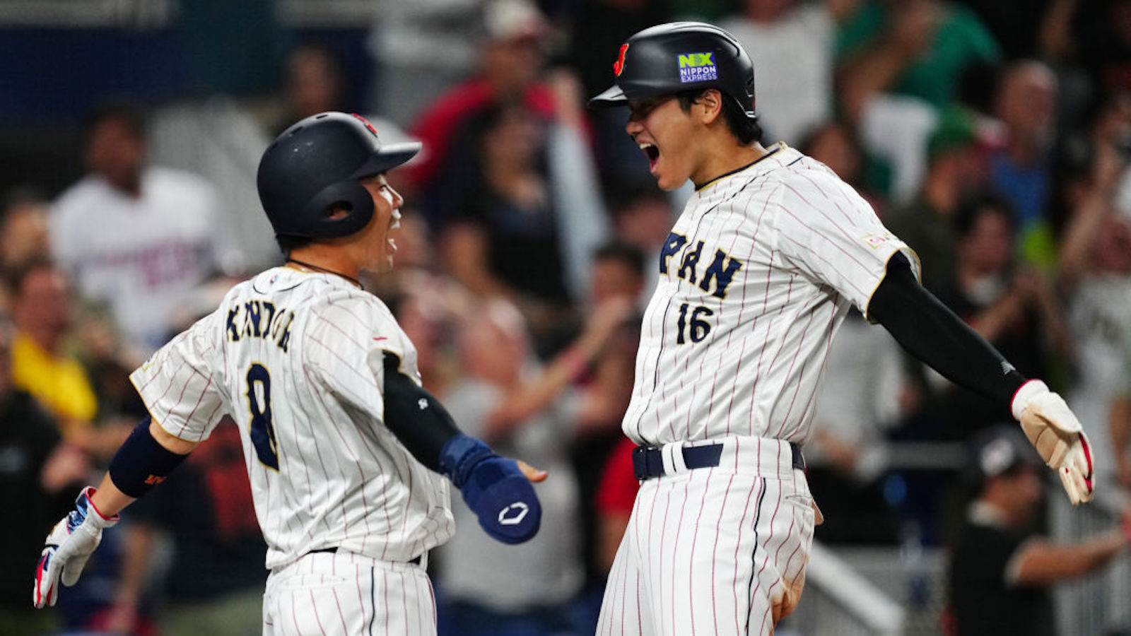 MIAMI, FL - MARCH 20: Kensuke Kondoh #8 and Shohei Ohtani #16 of Team Japan celebrate after scoring on a three-run home run hit by Masataka Yoshida #34 in the seventh inning during the 2023 World Baseball Classic Semifinal game between Team Mexico and Team Japan at loanDepot Park on Monday, March 20, 2023 in Miami, Florida.
