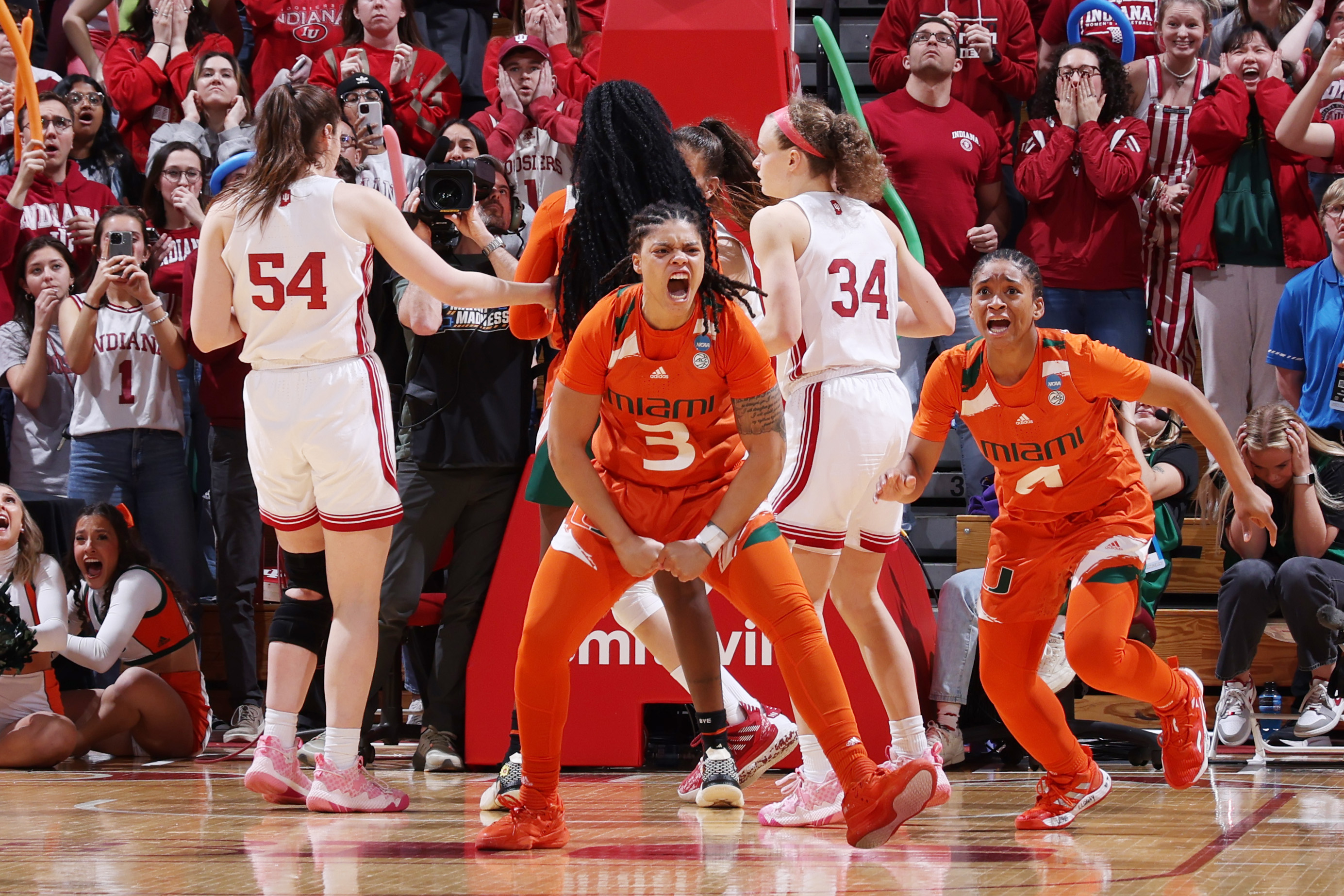 Destiny Harden #3 of the Miami Hurricanes reacts after making the game winning shot against the Indiana Hoosiers during the second round of the 2023 NCAA Women's Basketball Tournament held at Simon Skjodt Assembly Hall on March 20, 2023 in Bloomington, Indiana.