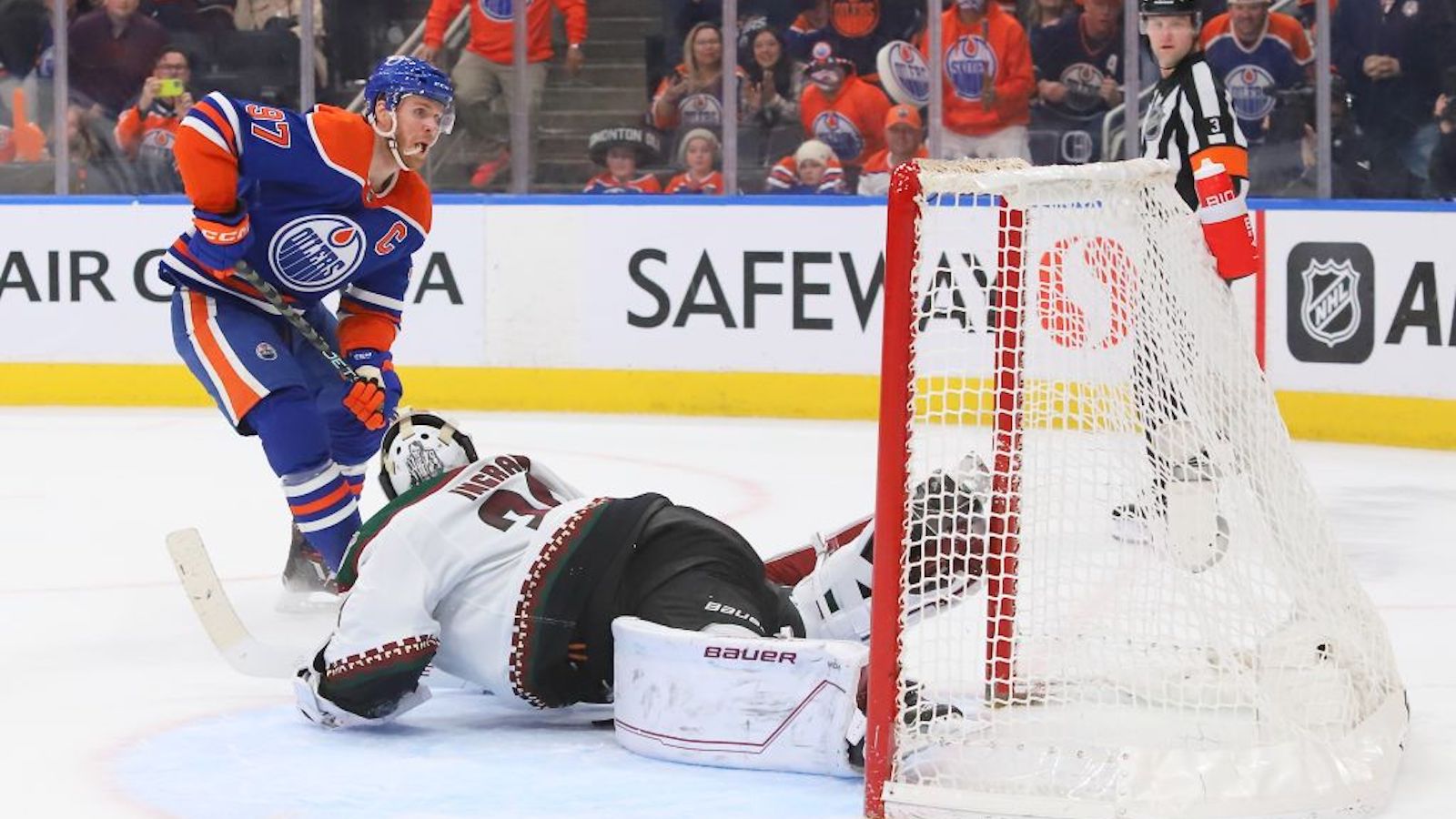 EDMONTON, CANADA - MARCH 22: Connor McDavid #97 of the Edmonton Oilers scores a goal in overtime against the Arizona Coyotes at Rogers Place on March 22, 2023 in Edmonton, Alberta, Canada. The goal is his 60th of the season.