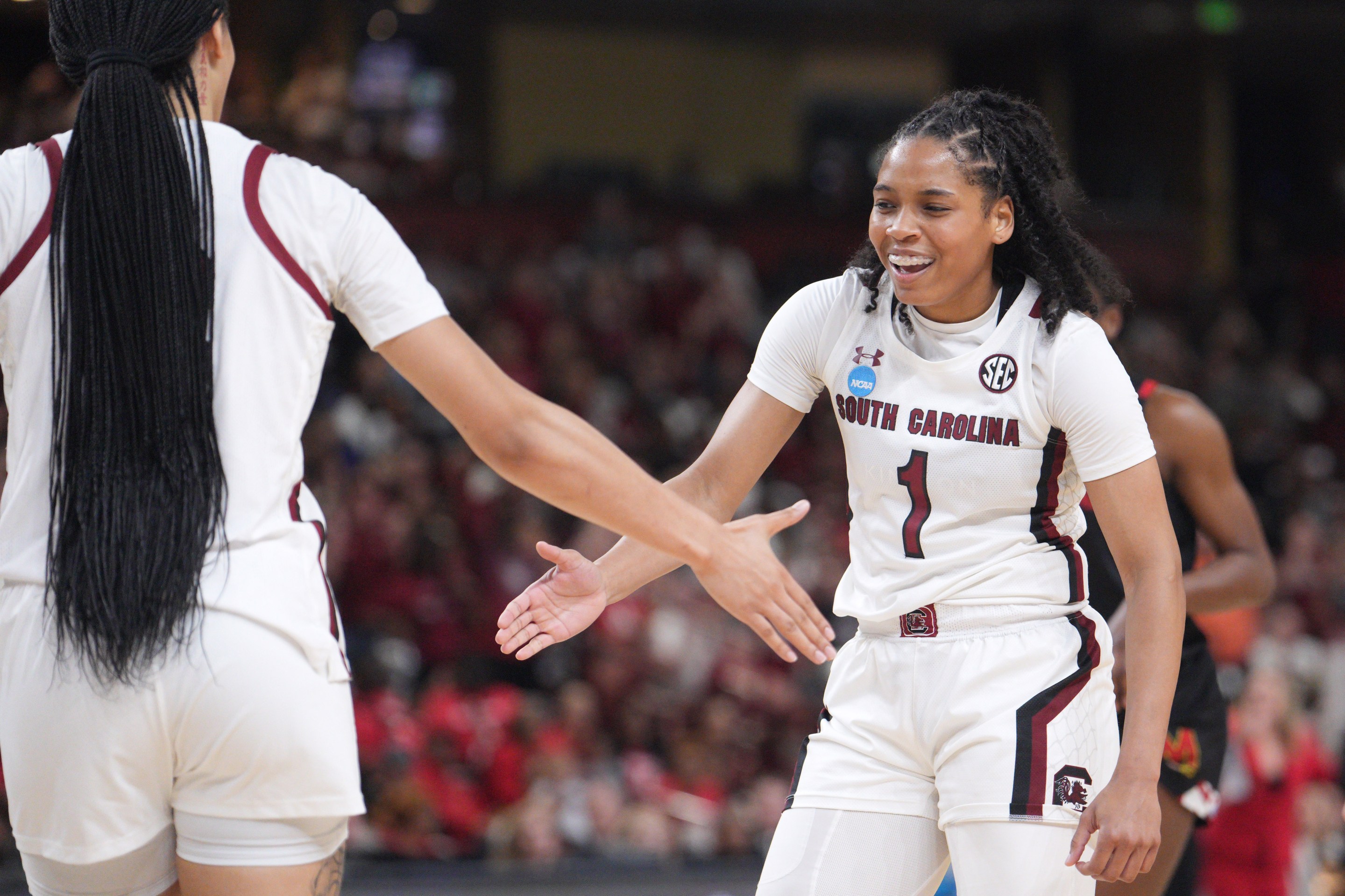 GREENVILLE, SC - MARCH 27: Zia Cooke #1 and Brea Beal #12 of the South Carolina Gamecocks celebrate in the closing minutes of their victory over the Maryland Terrapins during the Elite Eight round of the 2023 NCAA Womens Basketball Tournament held at Bon Secours Wellness Arena on March 27, 2023 in Greenville, South Carolina.