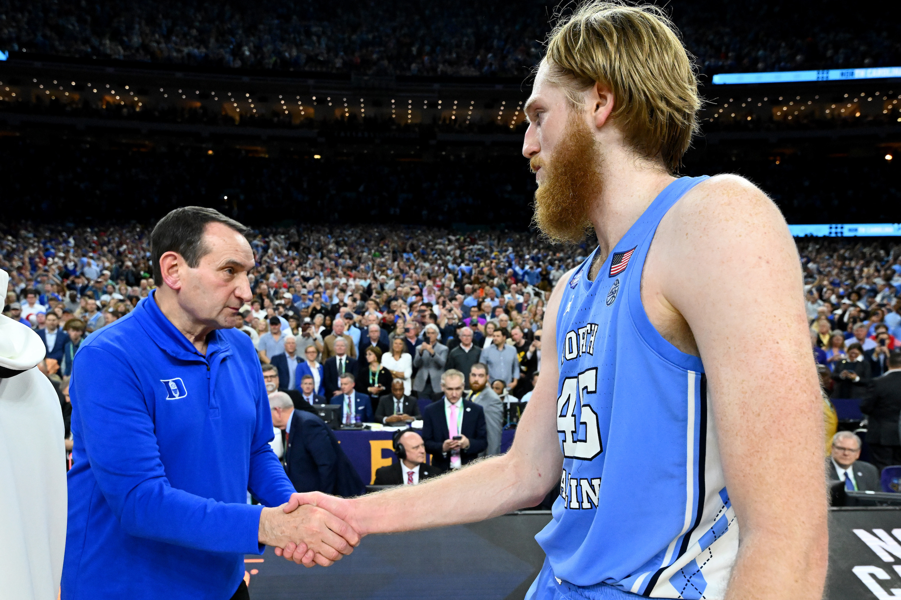 Duke coach Mike Krzyzewski congratulates UNC forward Brady Manek after his Blue Devils lost in the 2022 Final Four.