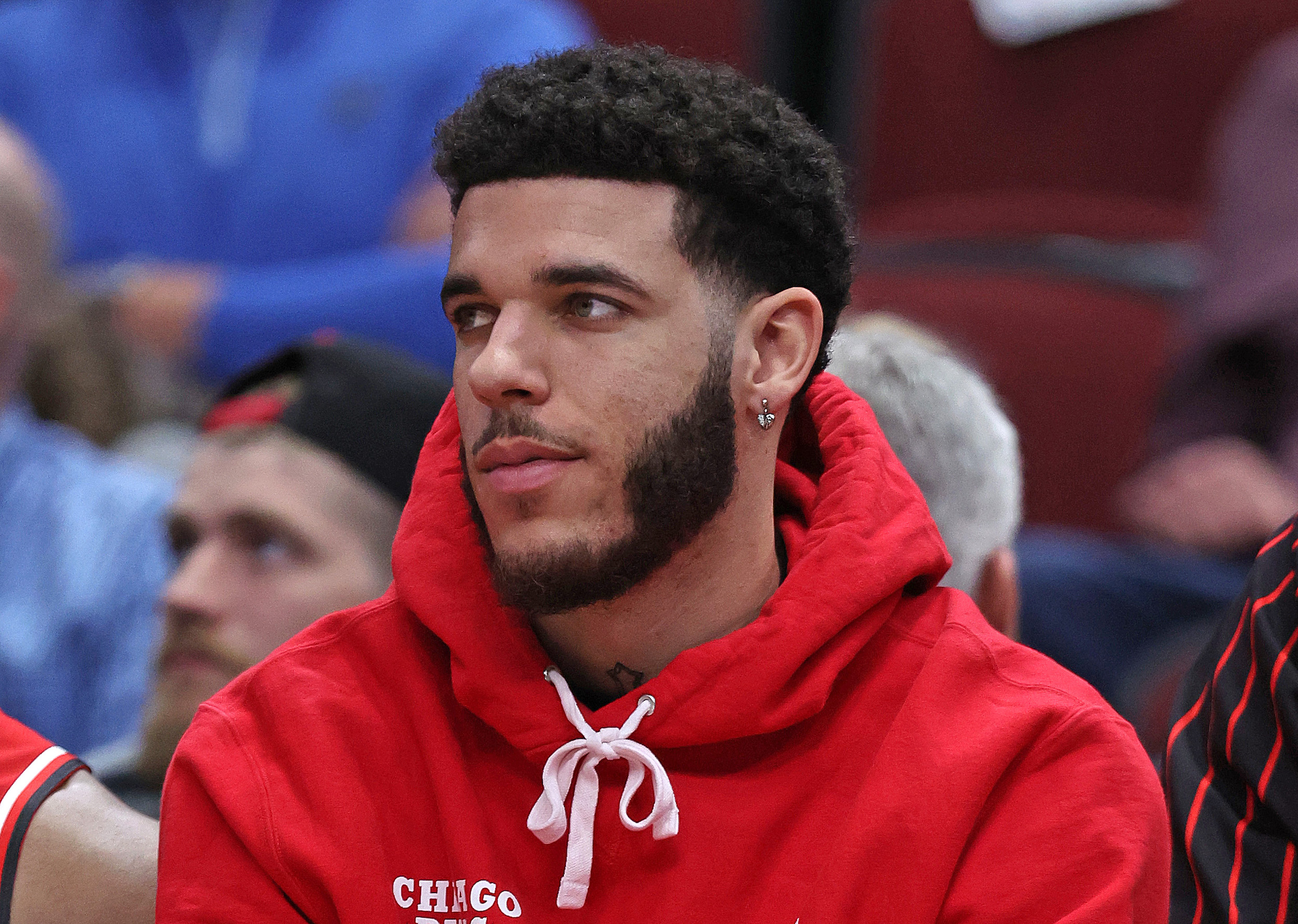 Lonzo Ball sits in street clothes.