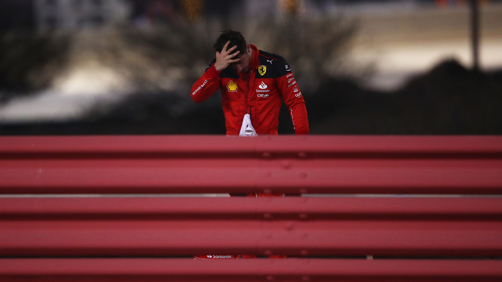 Charles Leclerc of Monaco and Ferrari looks on after retiring from the race during the F1 Grand Prix of Bahrain at Bahrain International Circuit on March 05, 2023 in Bahrain, Bahrain.
