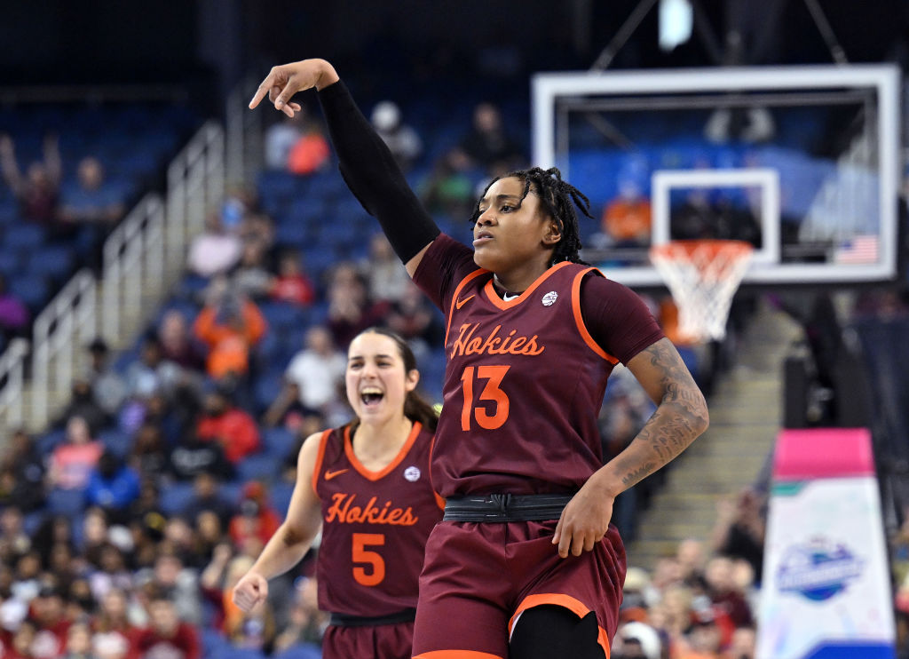 Taylor Soule #13 and Georgia Amoore #5 of the Virginia Tech Hokies reacts after a three-point basket by Soule against the Louisville Cardinals during the second half of the ACC Women's Basketball Tournament Championship game at Greensboro Coliseum on March 05, 2023 in Greensboro, North Carolina. Virginia Tech won 75-67.